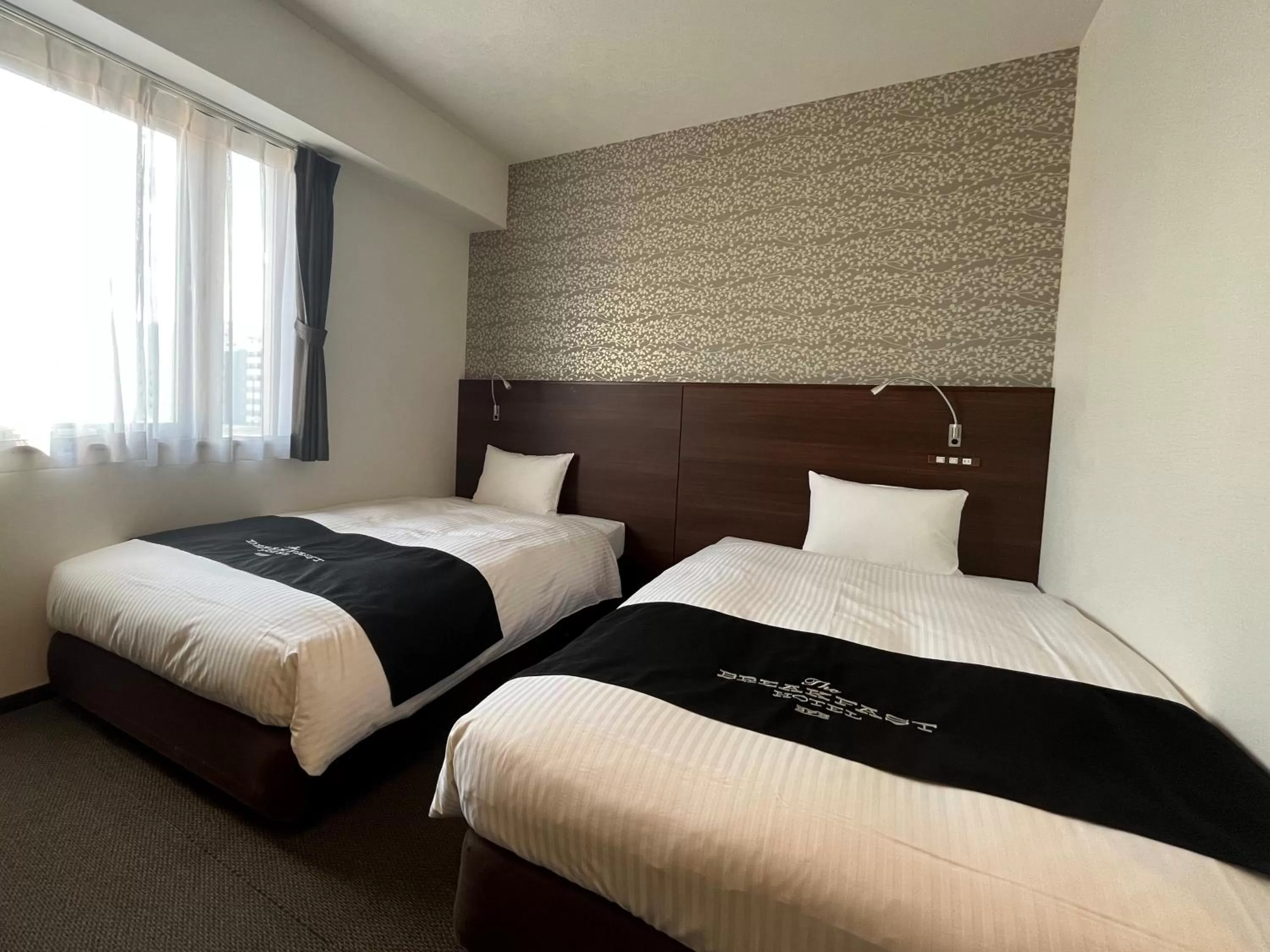 Bed in The BREAKFAST HOTEL Fukuoka Tenjin