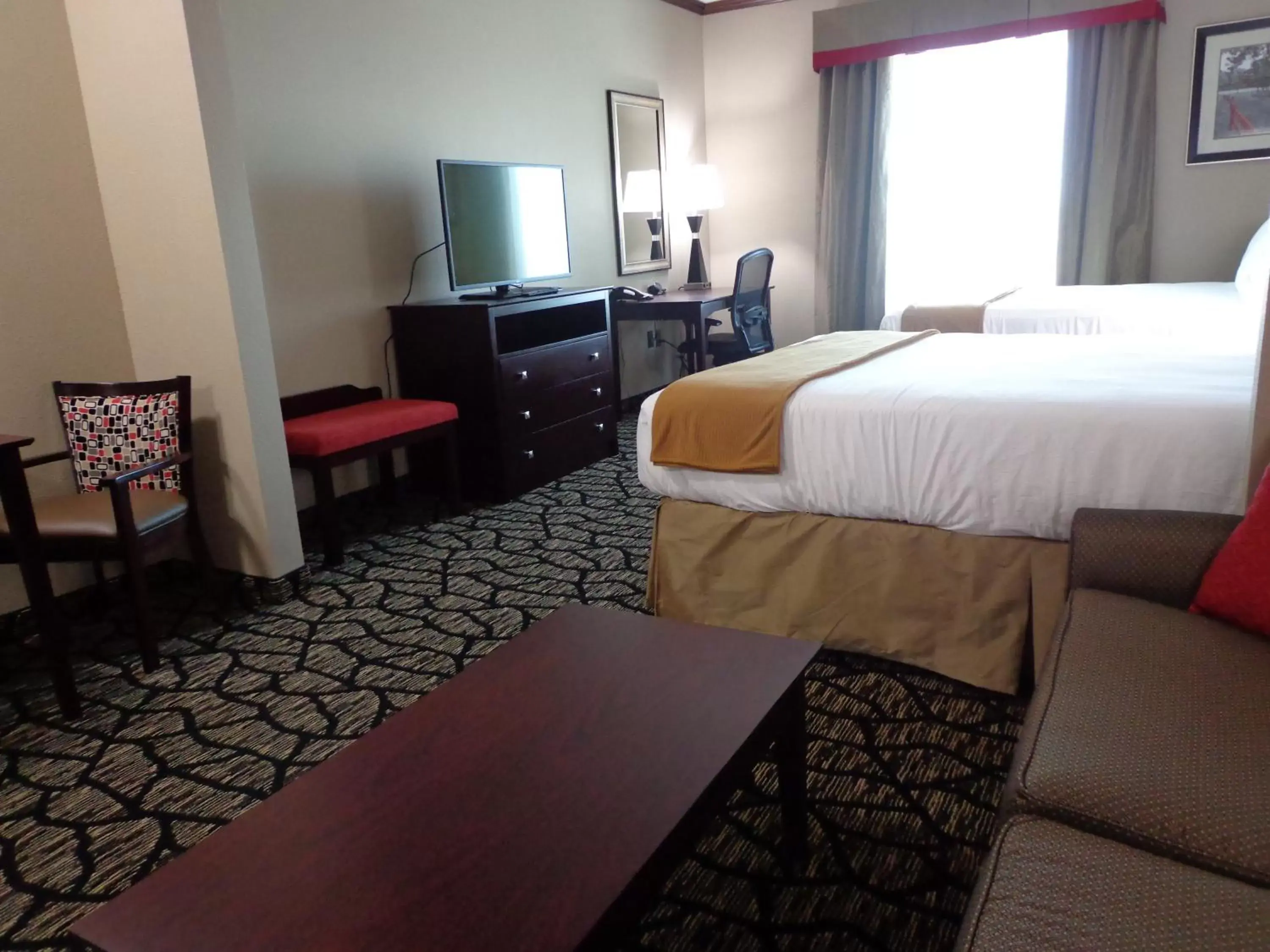 Photo of the whole room, TV/Entertainment Center in Holiday Inn Express and Suites Lubbock South, an IHG Hotel