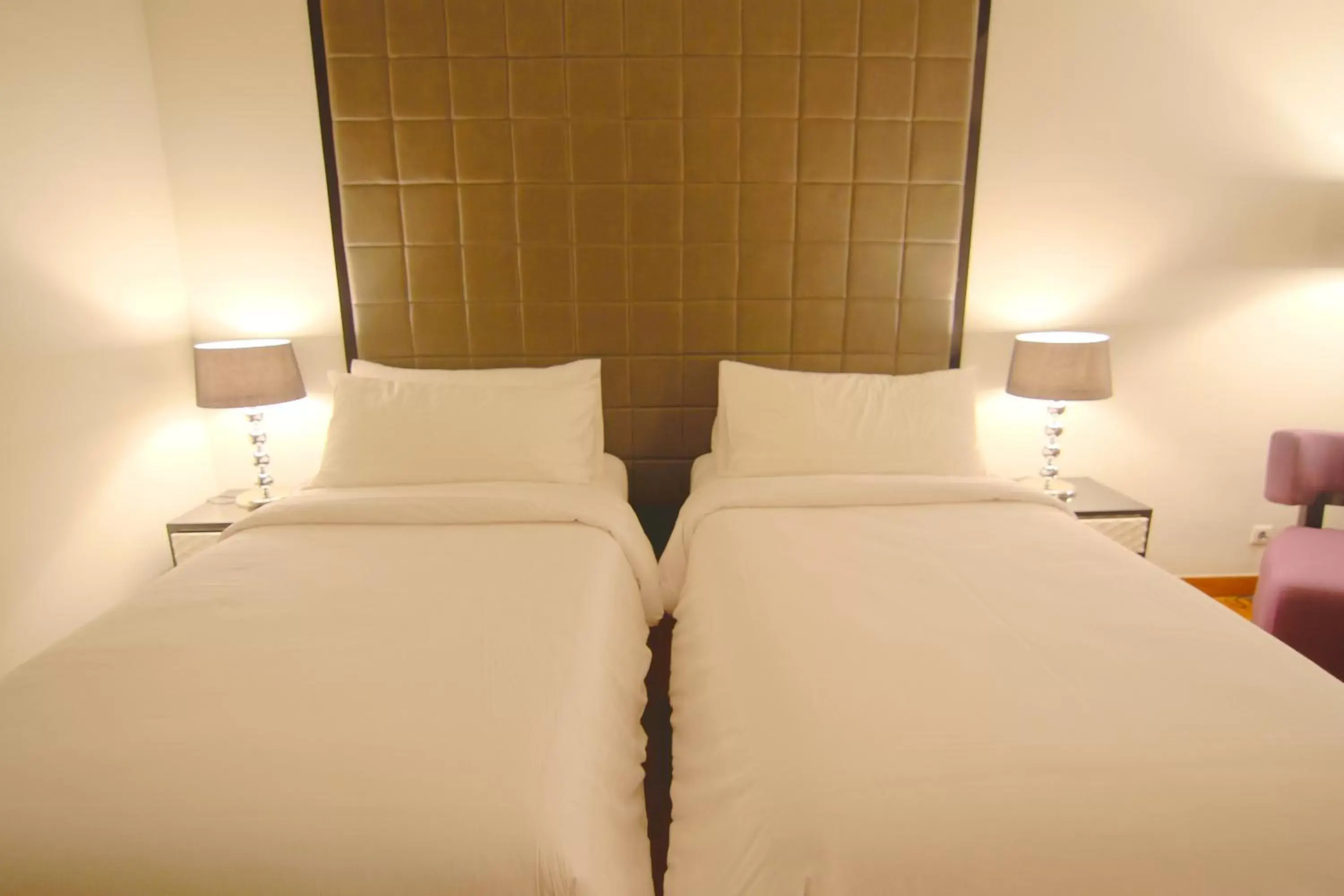 Bed in Diradja Hotel Indonesia