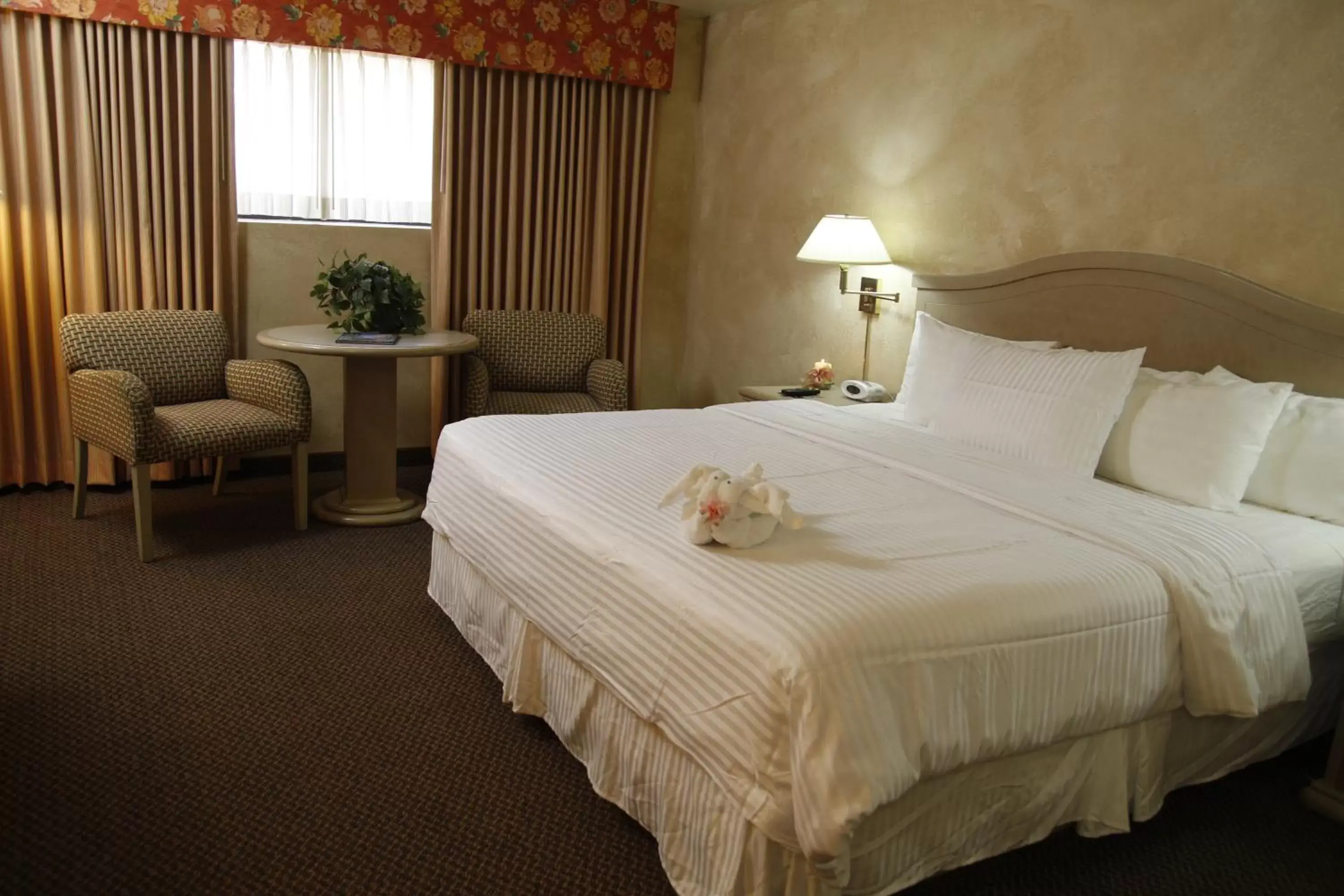 Bed in Ramada by Wyndham Viscount Suites Tucson East