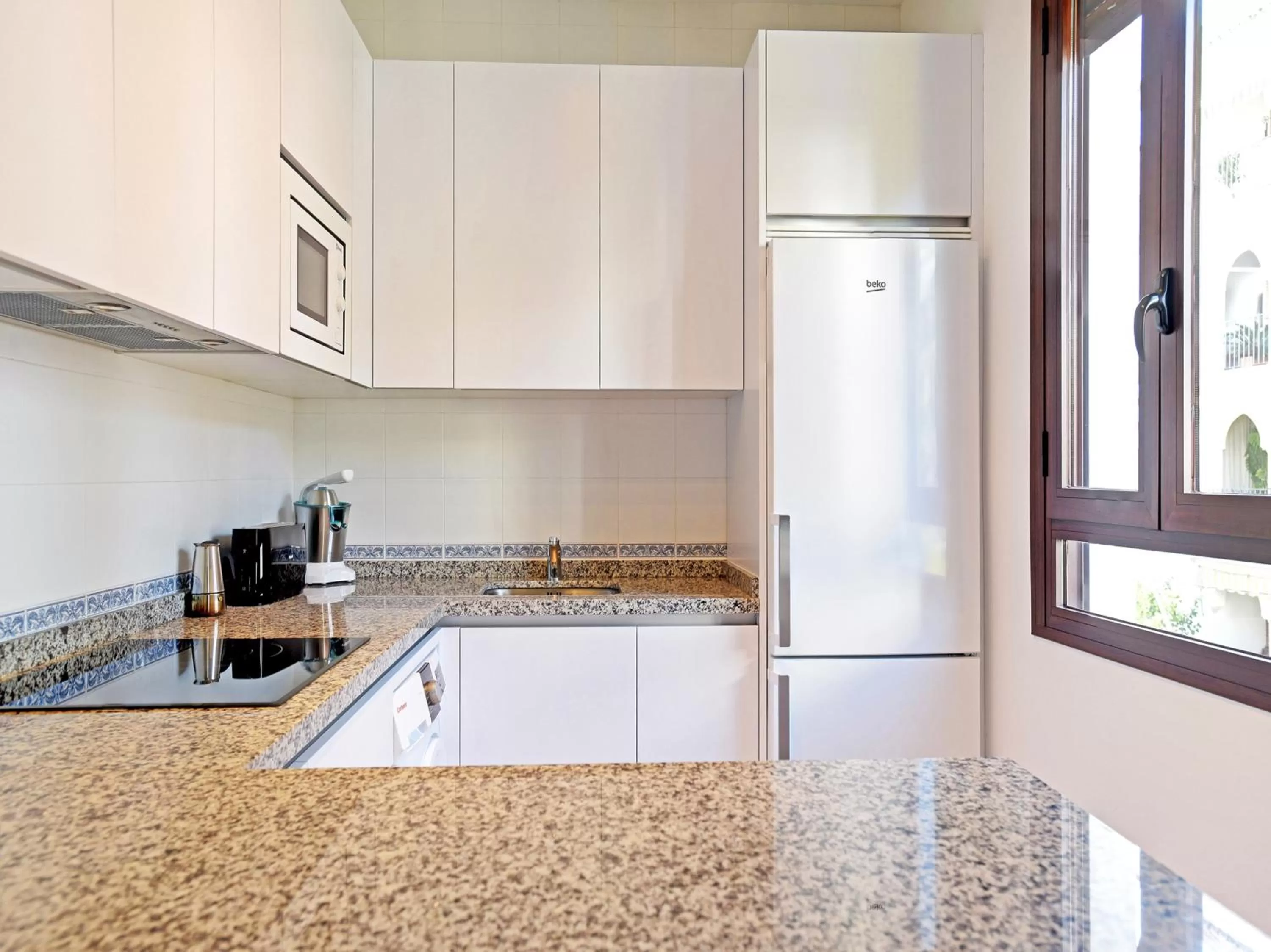 Kitchen or kitchenette in Apartamentos Santiago