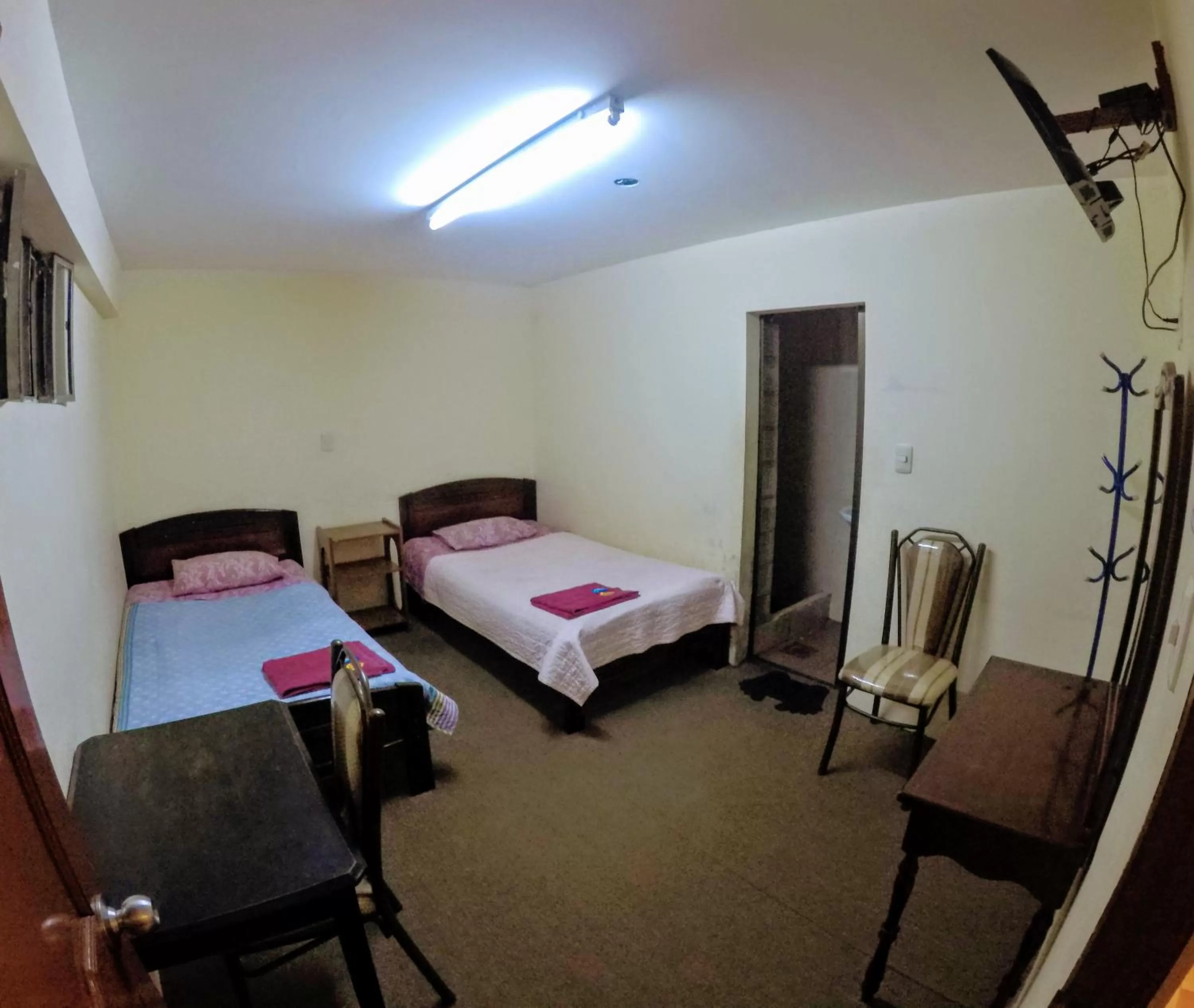 Photo of the whole room, Bed in Residencial Uruguay