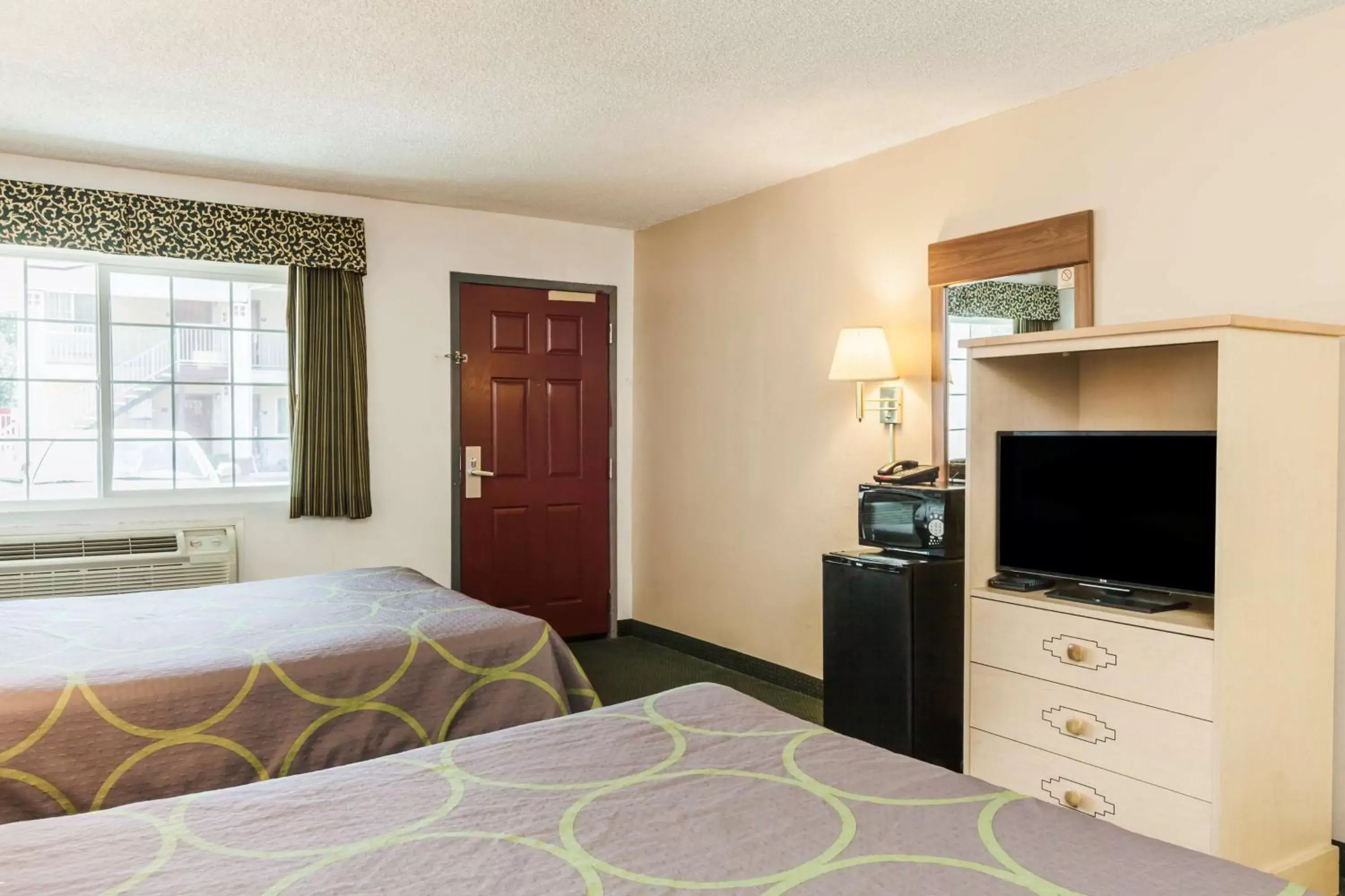Queen Room with Two Queen Beds - Smoking in Super 8 by Wyndham Visalia