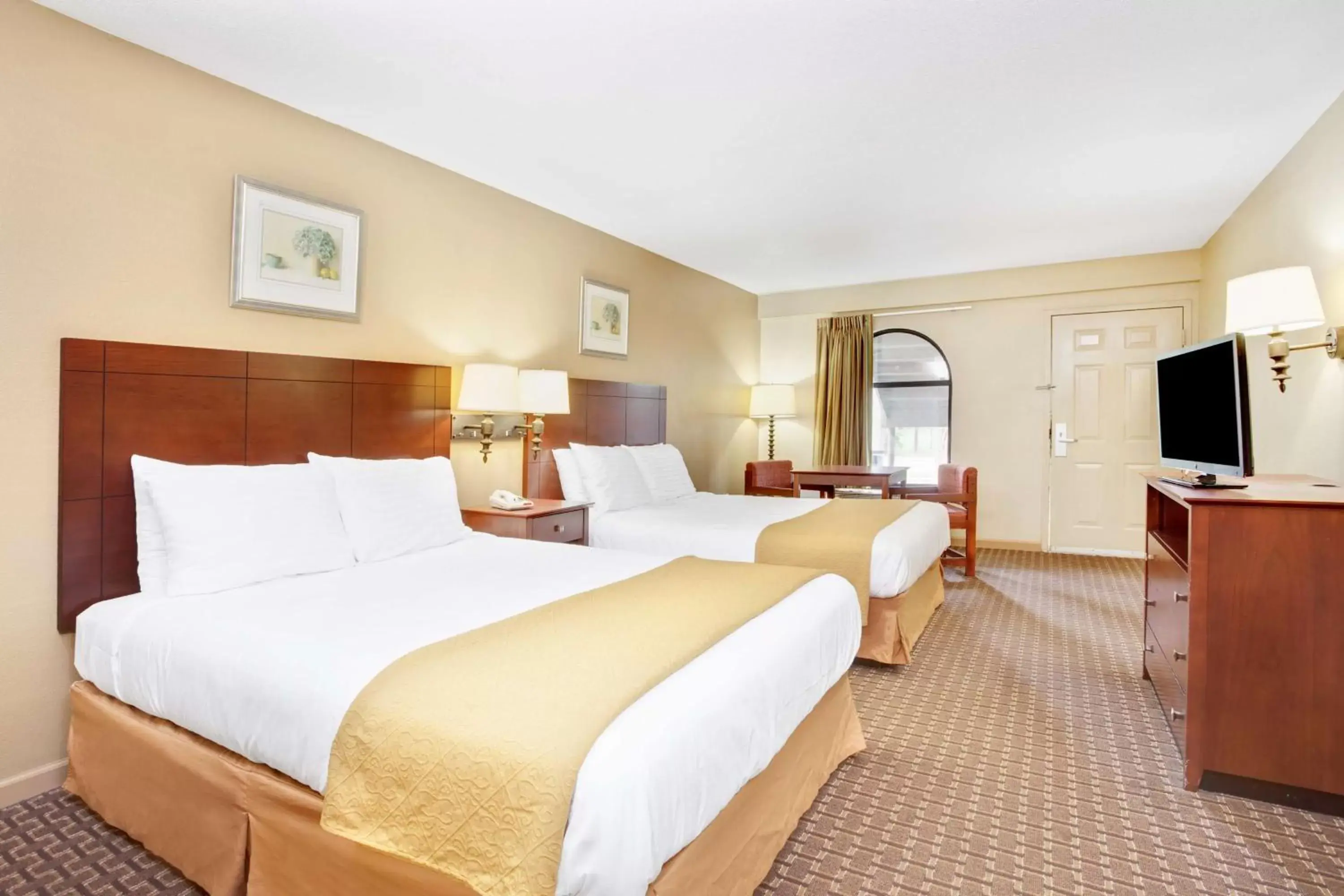 Queen Room with Two Queen Beds - Non-Smoking in Days Inn & Suites by Wyndham Stockbridge South Atlanta