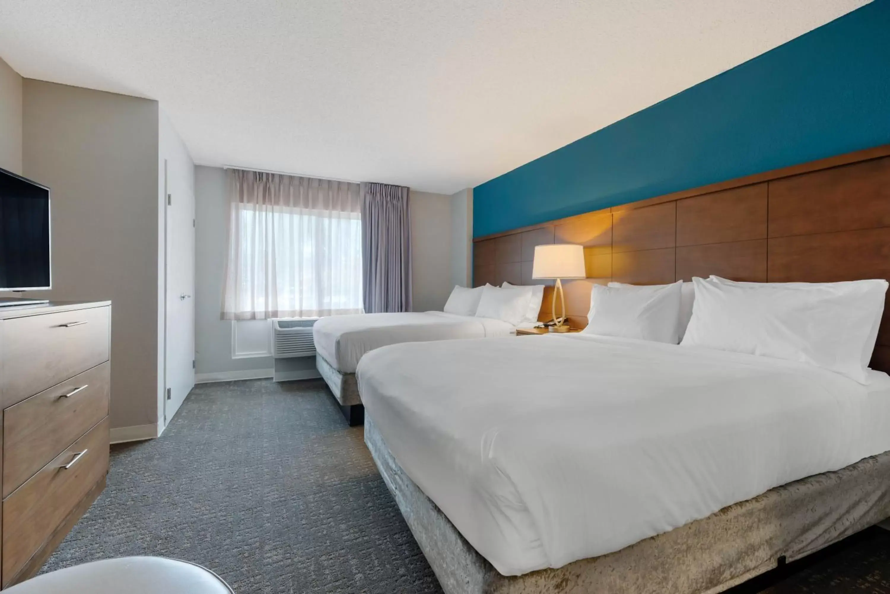 Bed in Staybridge Suites Orlando Royale Parc Suites, an IHG Hotel