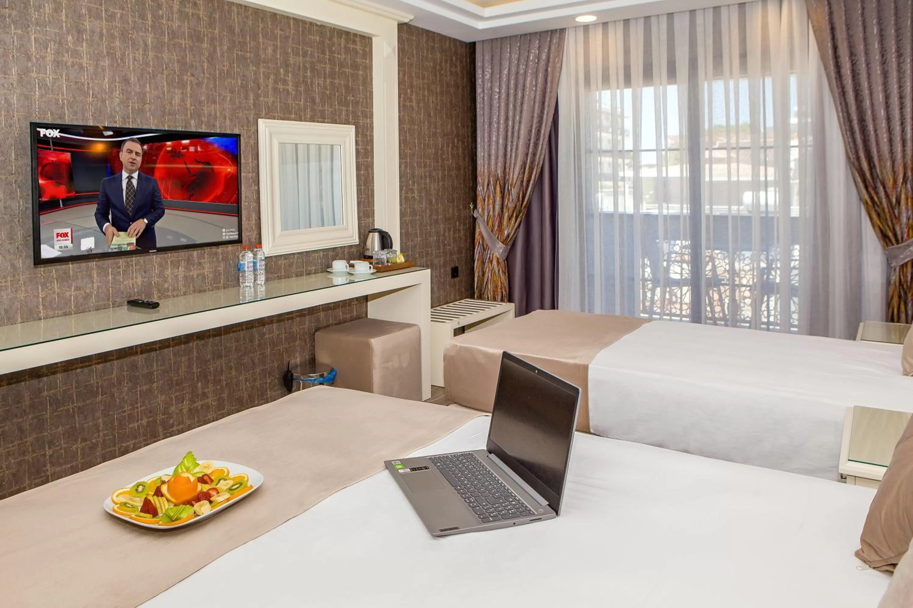 Communal lounge/ TV room, Bed in THE LEA HOTELS & SUITE