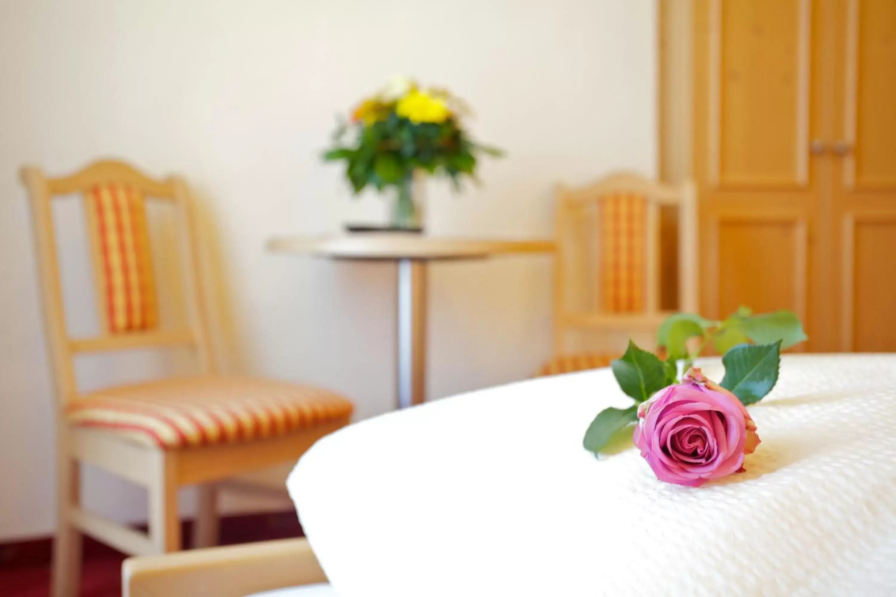 Bed, Seating Area in Hotel Castel Latemar