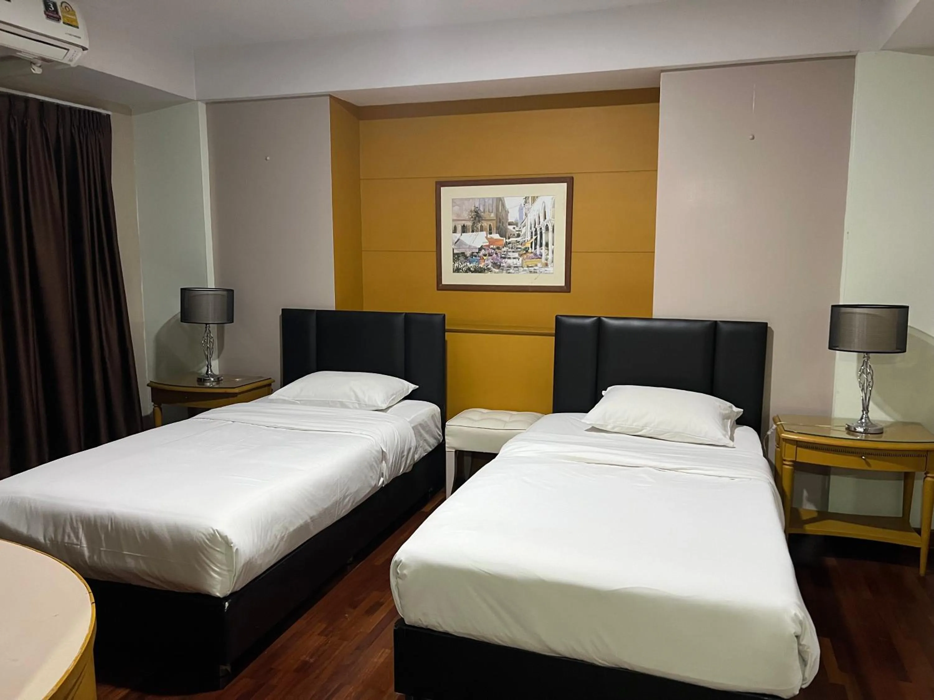 Bed in Mall Suites Hotel