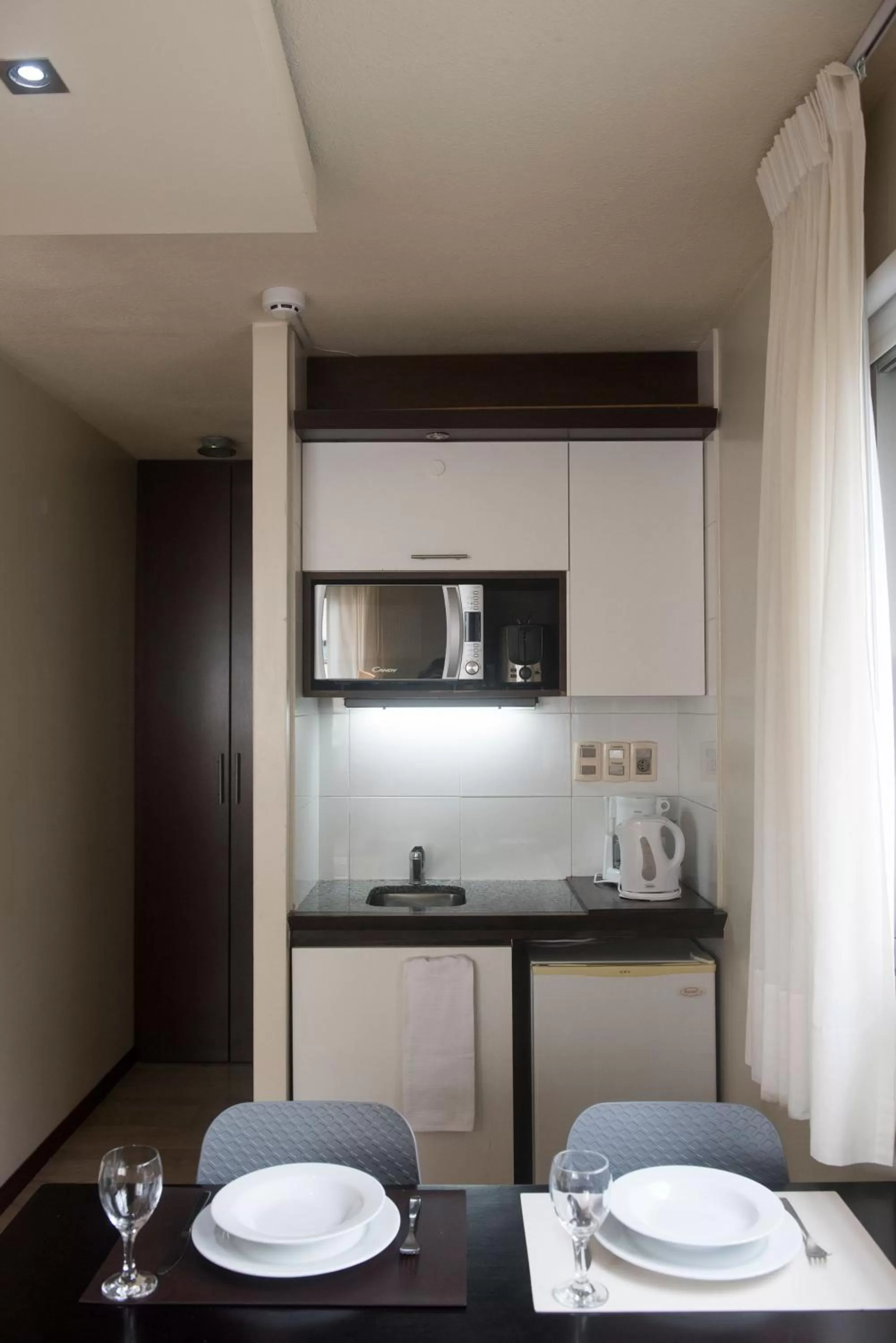 Kitchen or kitchenette in 27 Suites Hotel
