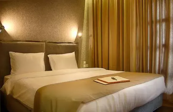Bed in Athlos Hotel