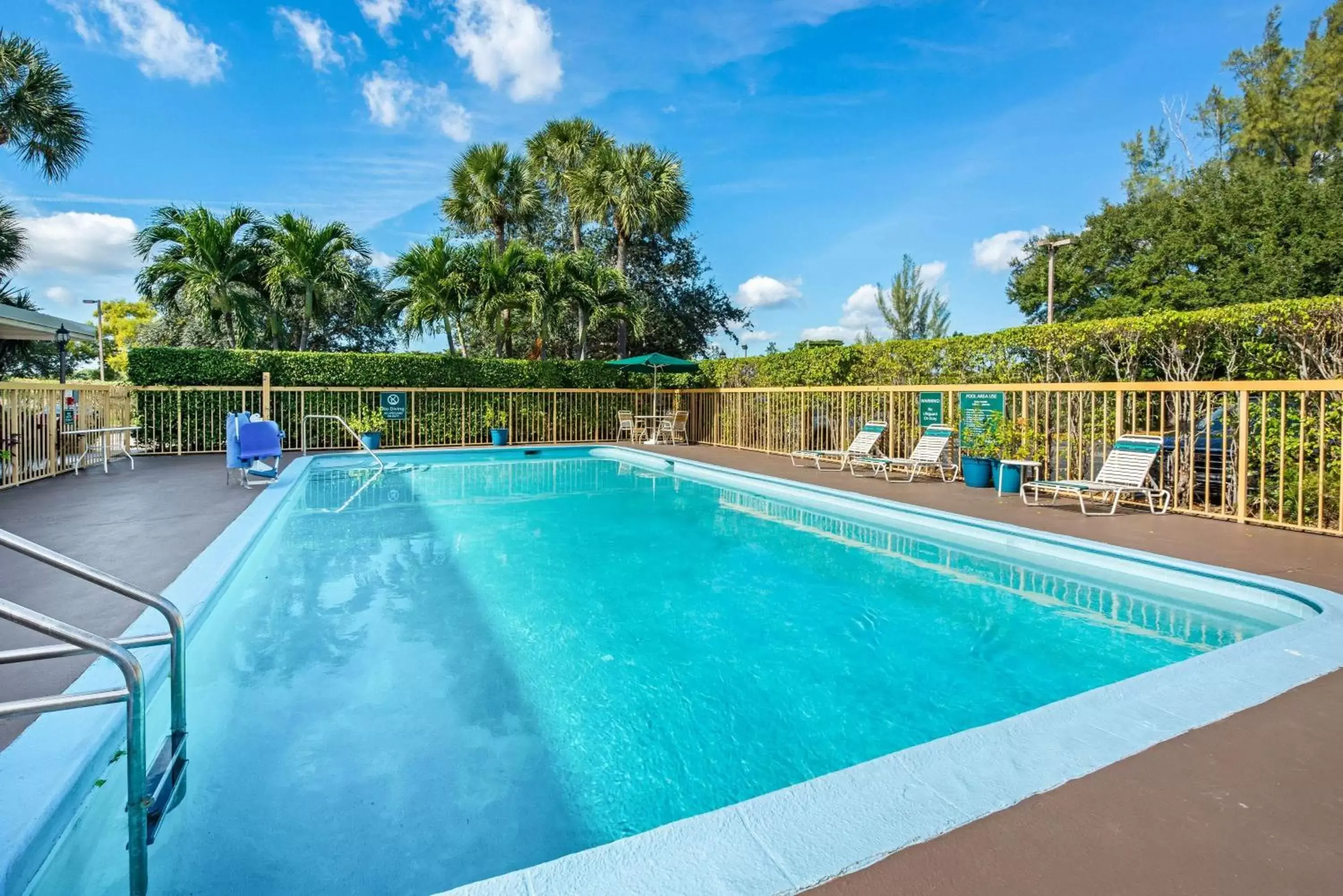 Pool view, Swimming Pool in La Quinta Inn by Wyndham West Palm Beach - Florida Turnpike