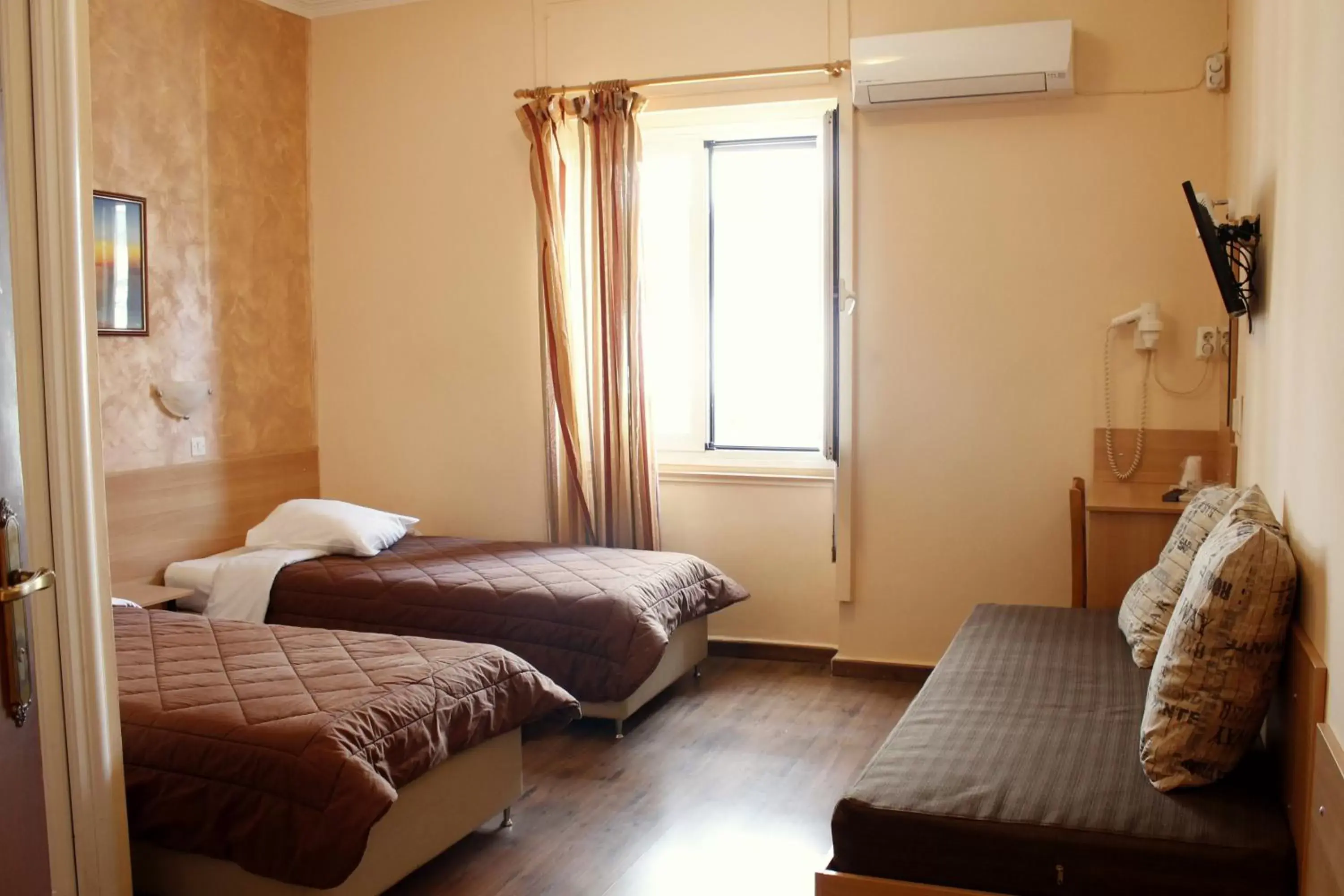 Bed in Electra Hotel Piraeus