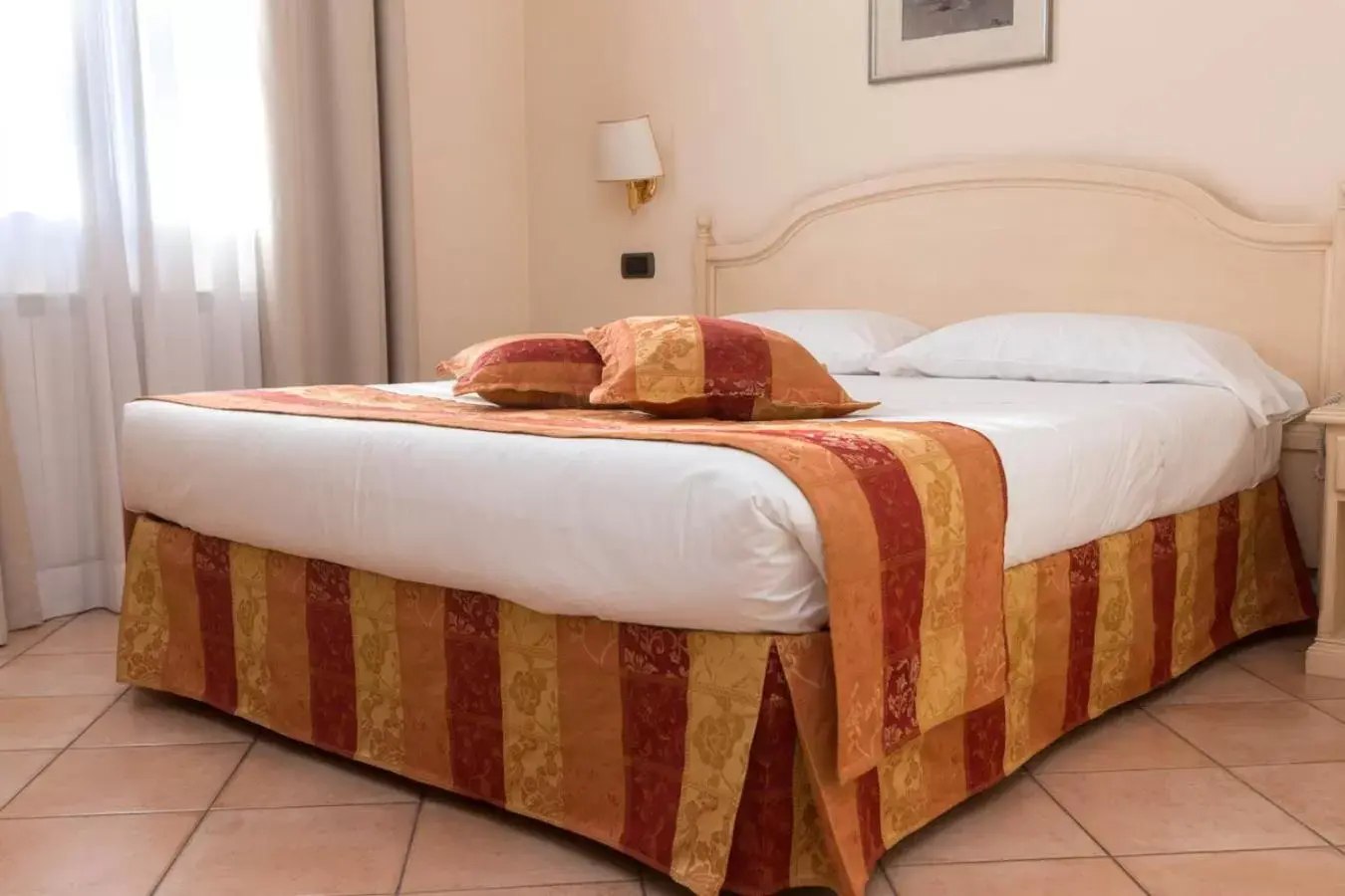 Bed in Hotel Le Mura