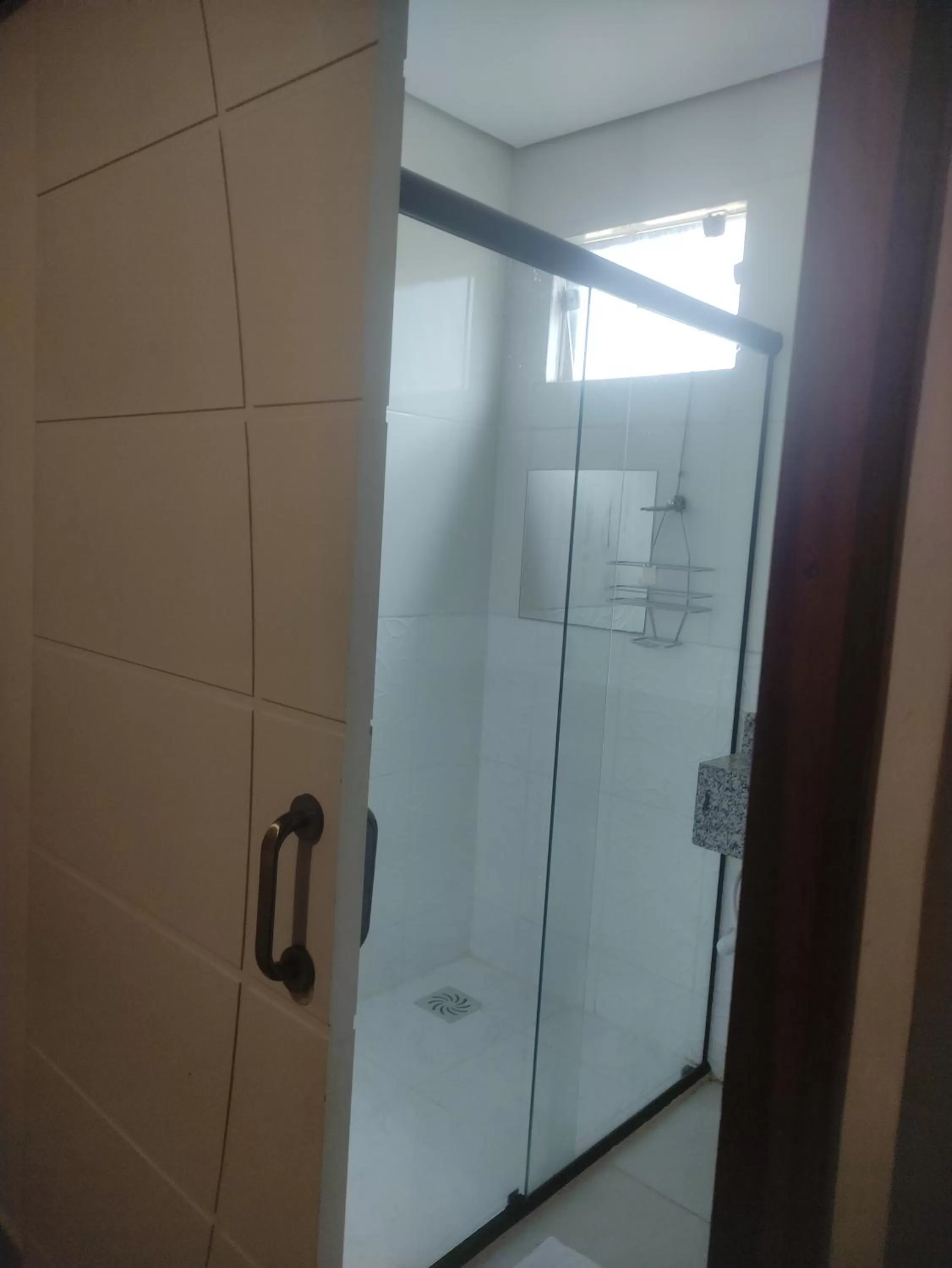 Bathroom in Pousada da Gi Suítes e Turismo