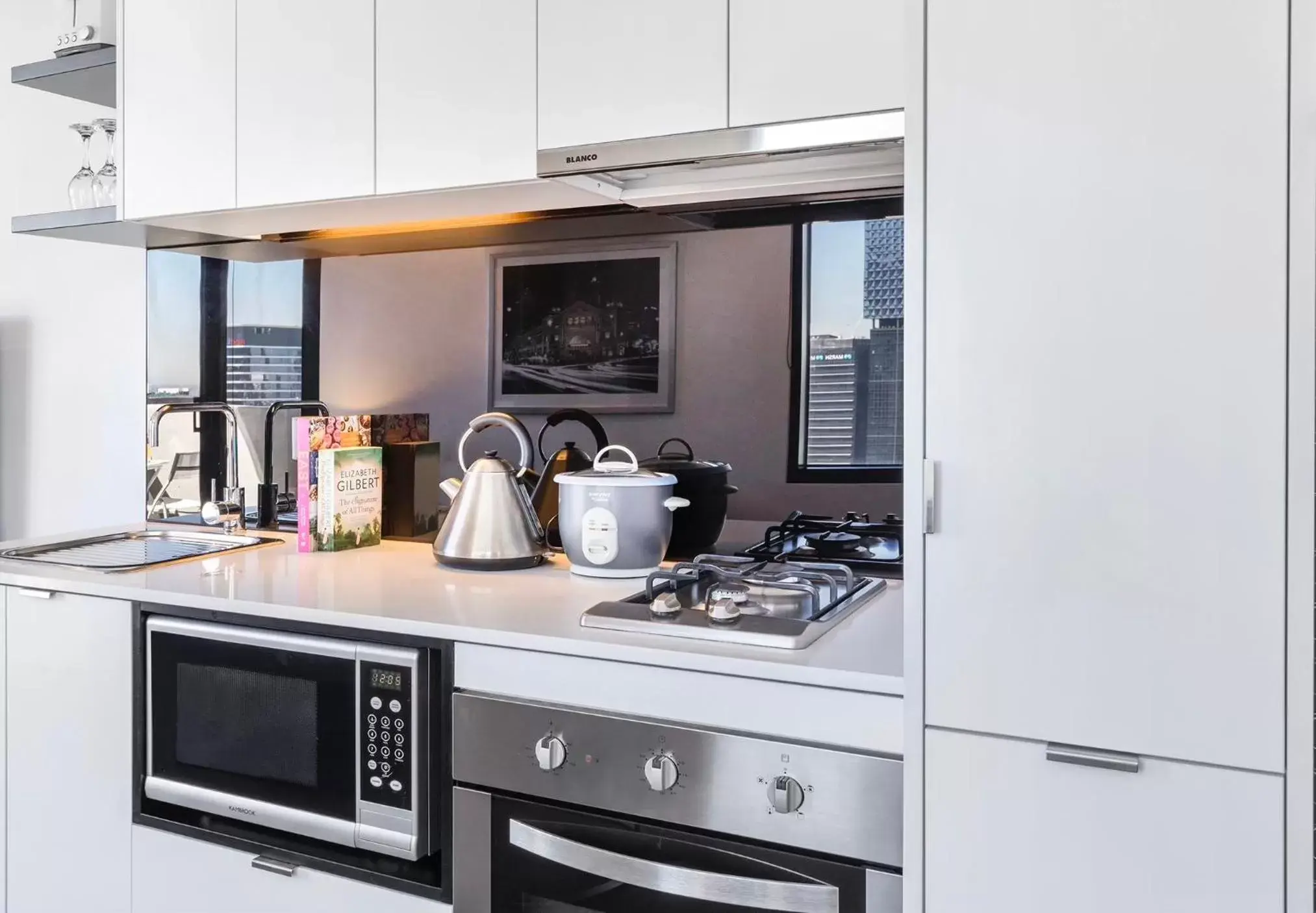 Kitchen/Kitchenette in Aura on Flinders Serviced Apartments