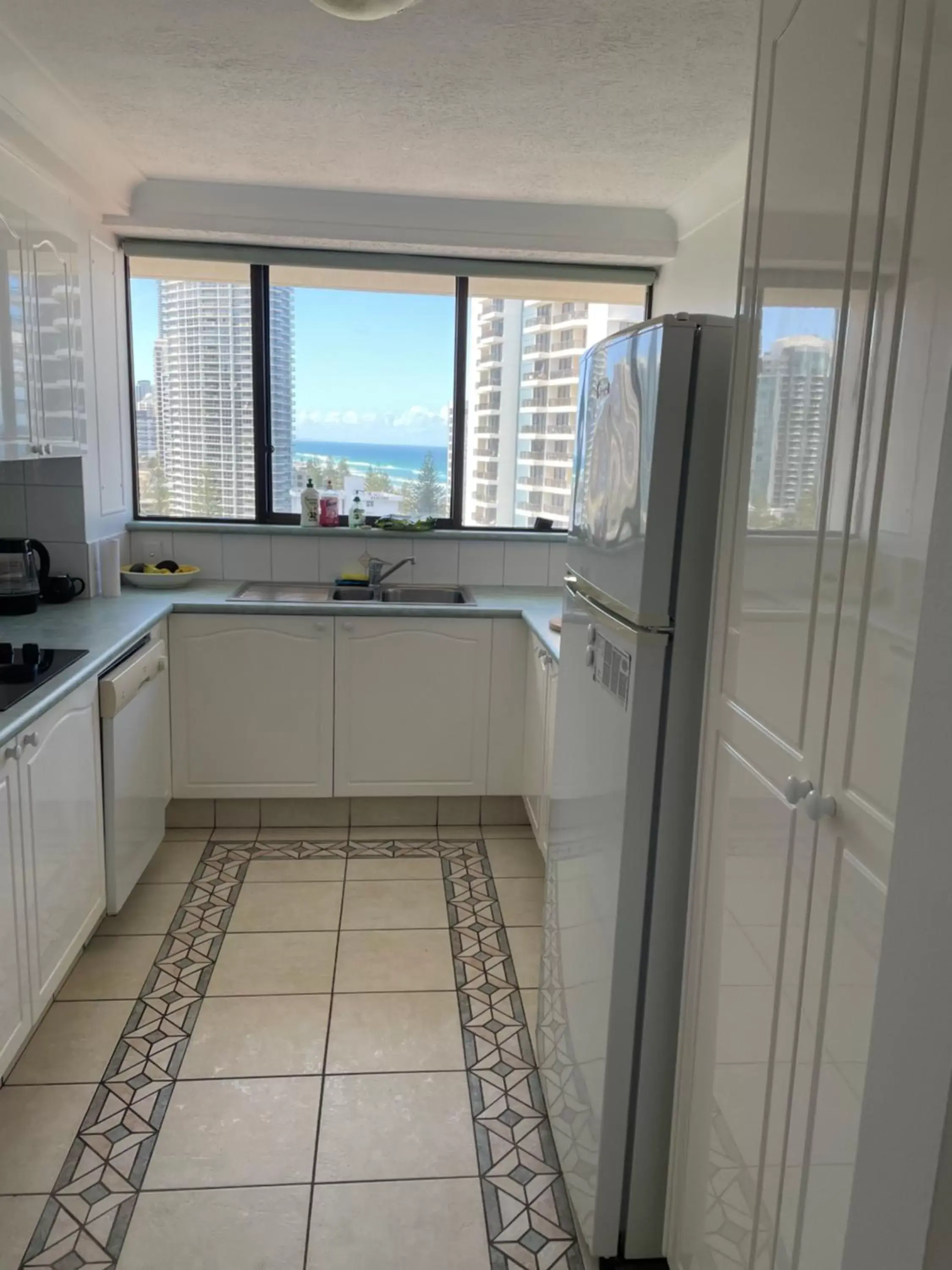 Kitchen/Kitchenette in Surfers Century Oceanside Apartments