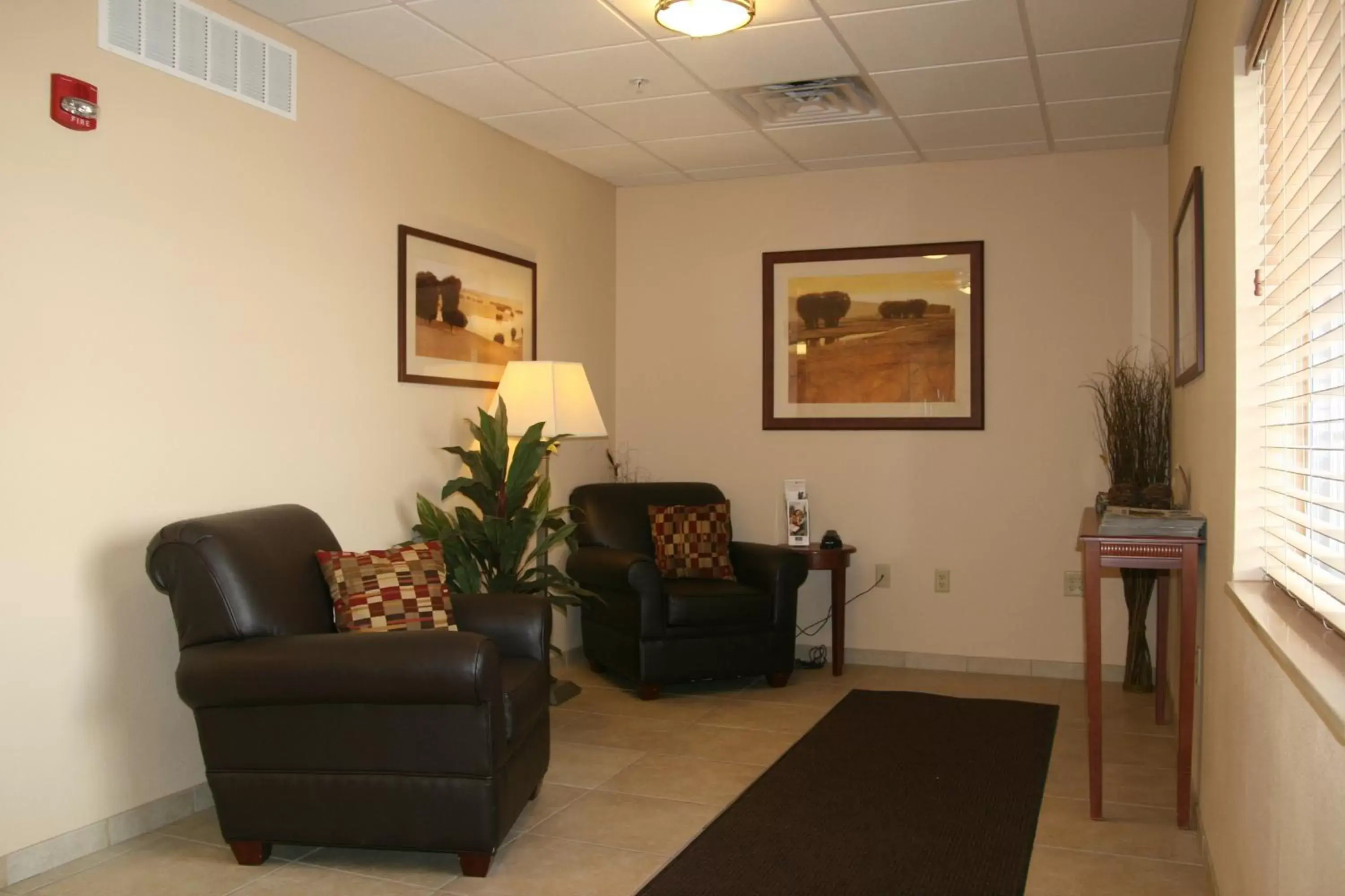 Property building, Seating Area in Candlewood Suites - Peoria at Grand Prairie, an IHG Hotel
