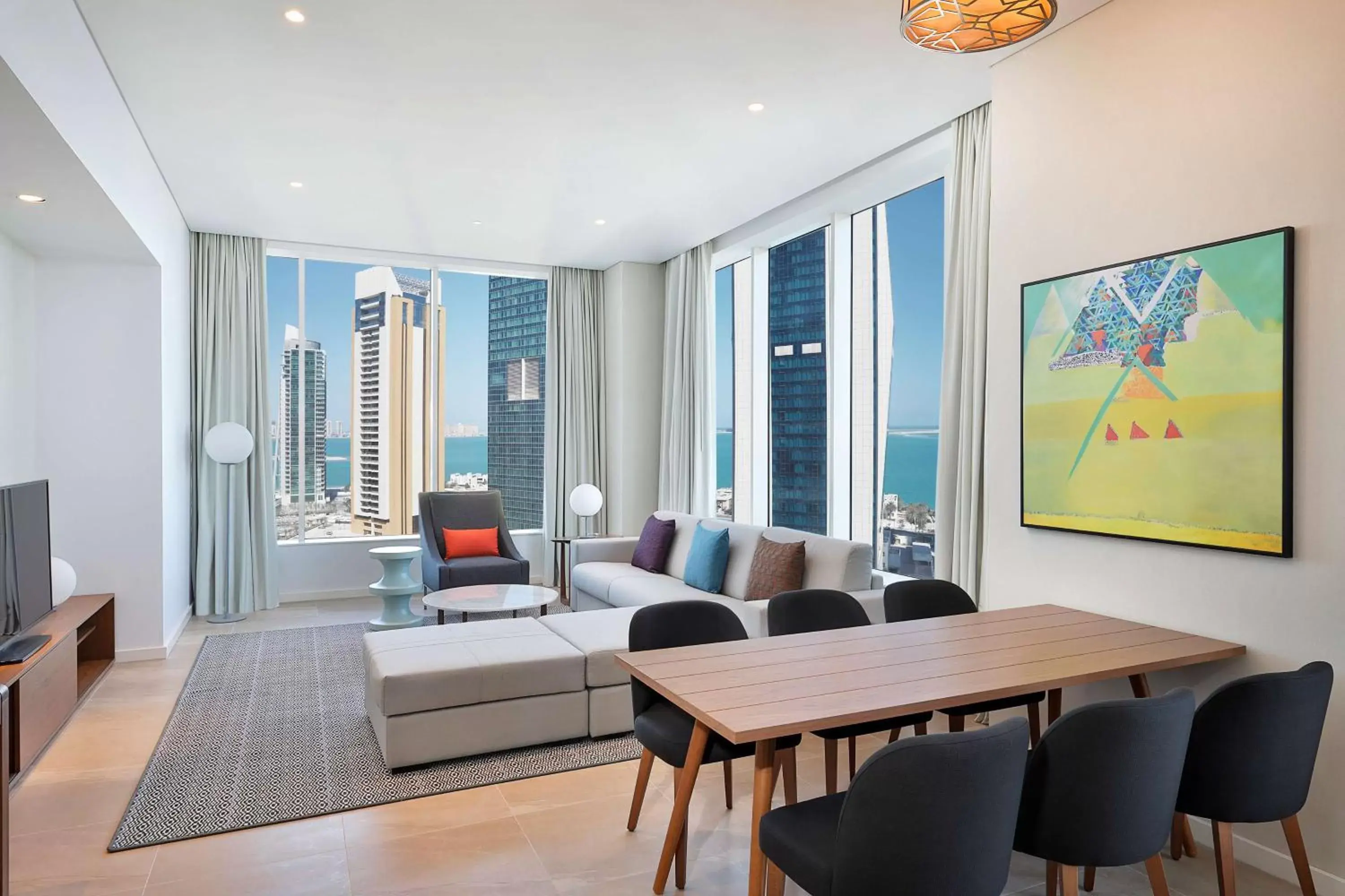 Living room, Dining Area in Aleph Doha Residences, Curio Collection By Hilton