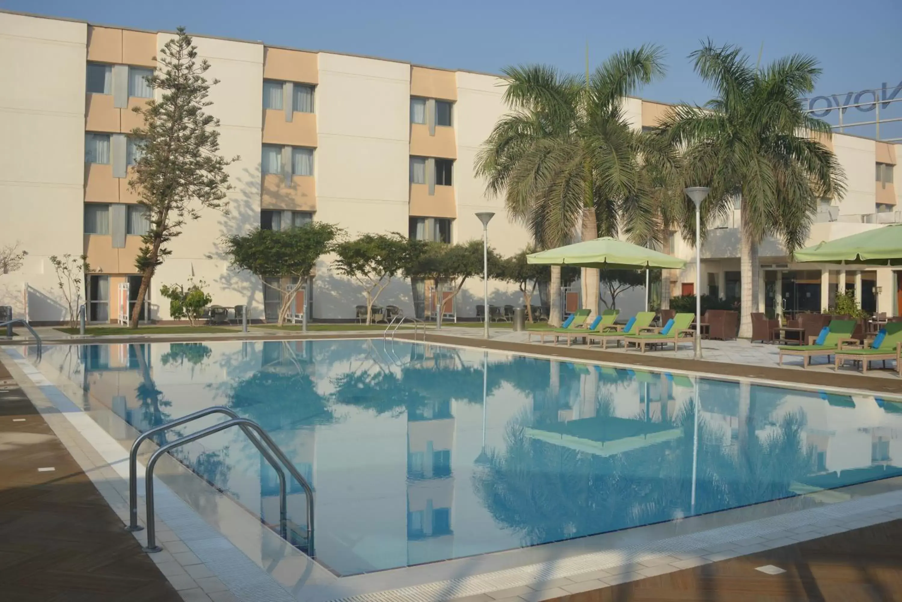 Swimming pool, Property Building in Novotel Cairo Airport