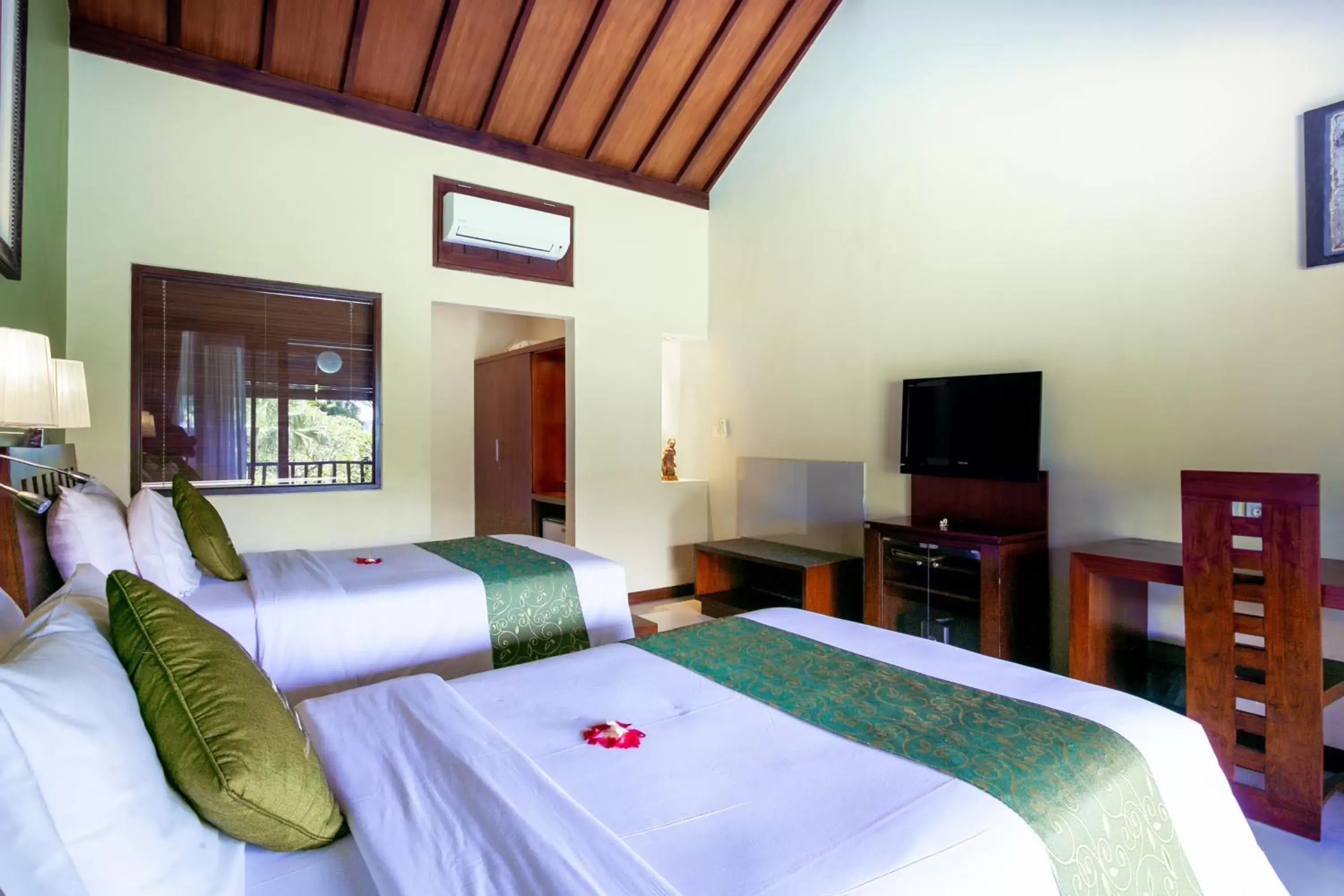 TV and multimedia, Bed in Lumbung Sari Ubud Hotel - CHSE Certified TV and multimedia, Bed in Lumbung Sari Ubud Hotel - CHSE Certified