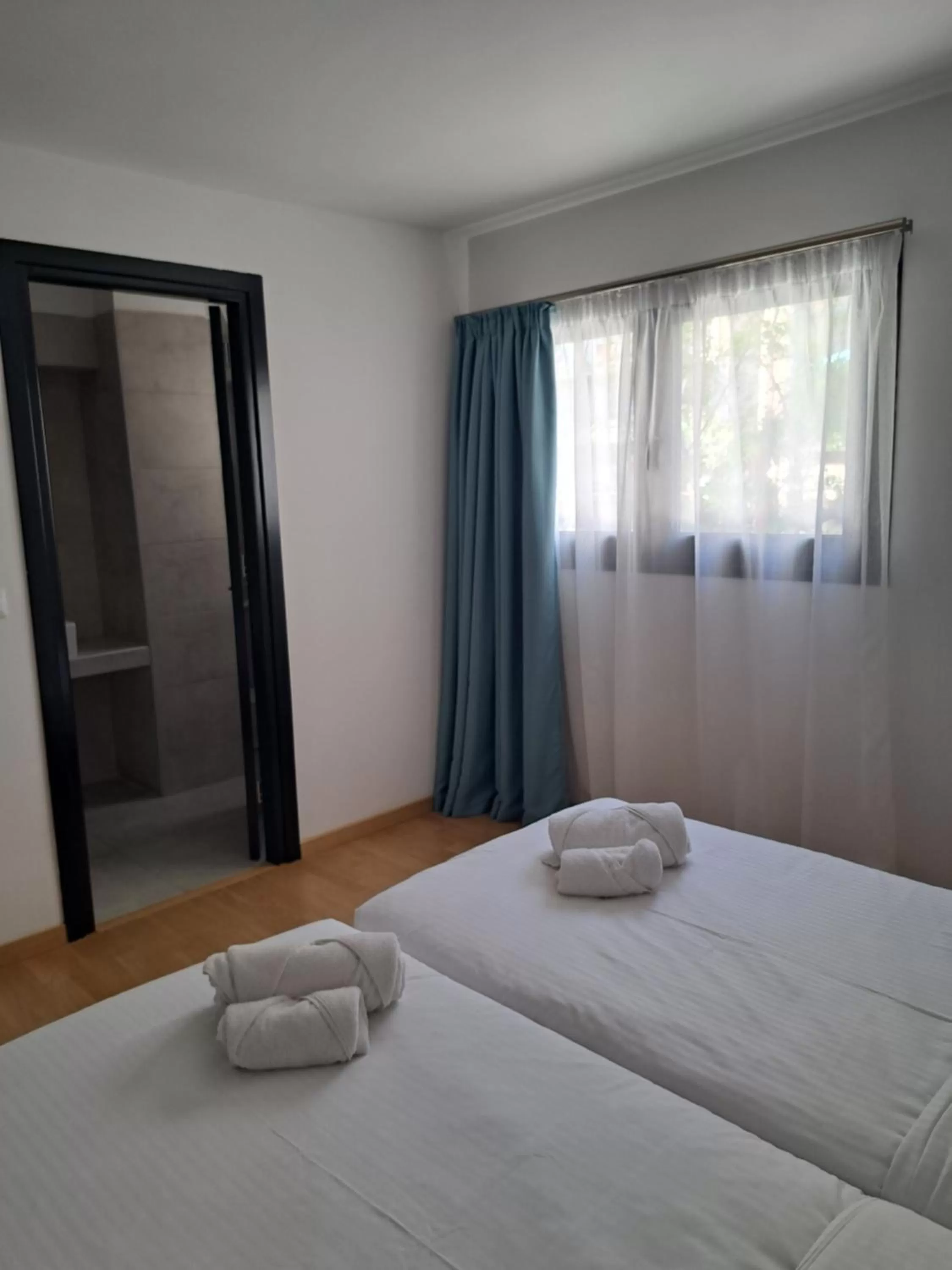 Bed in Evita's Luxury Apartments