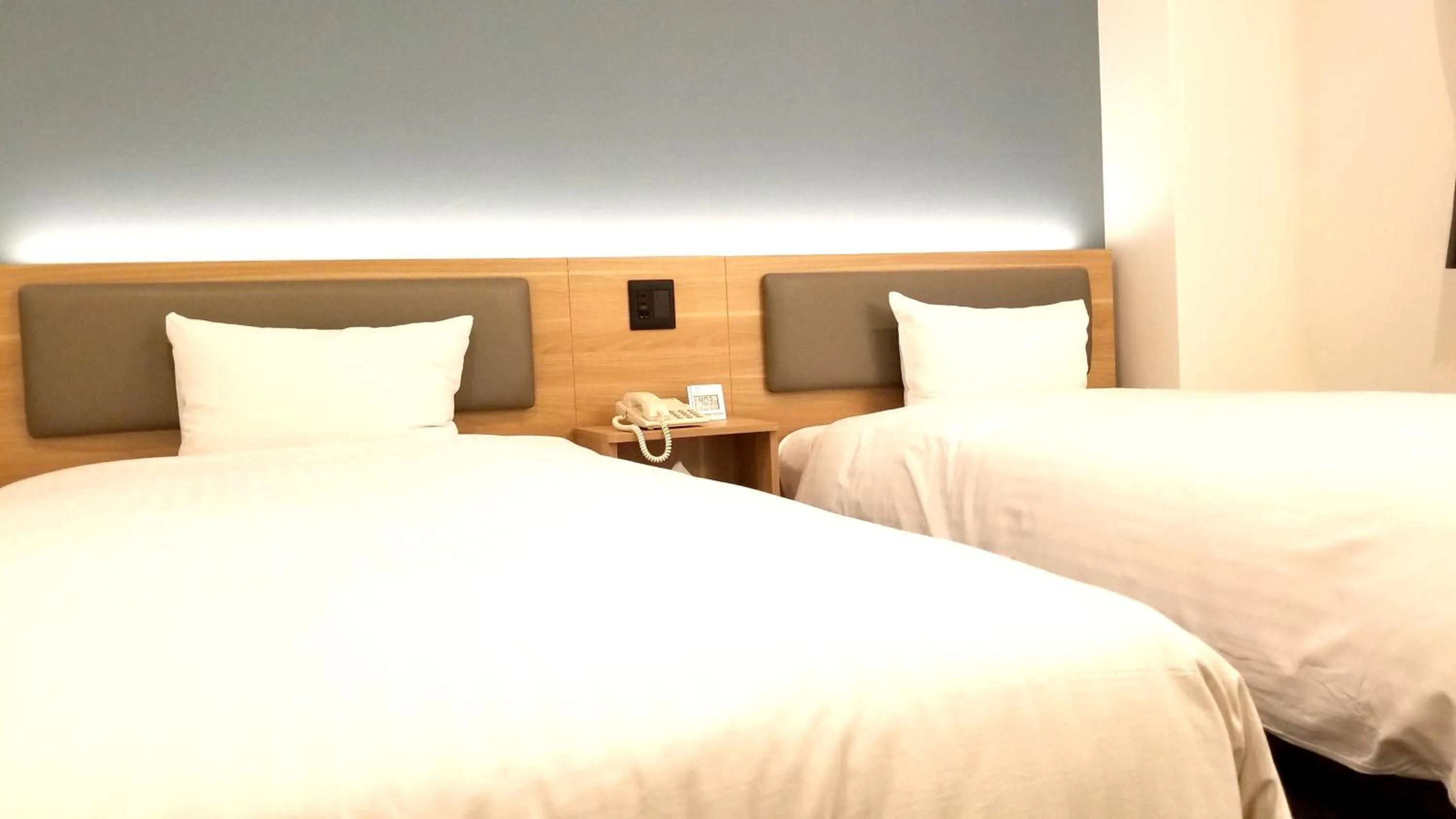 Bed in Kochi Sunrise Hotel