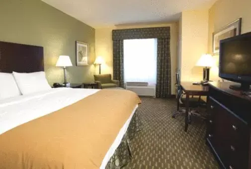 Bed, TV/Entertainment Center in Holiday Inn Express and Suites Saint Augustine North, an IHG Hotel