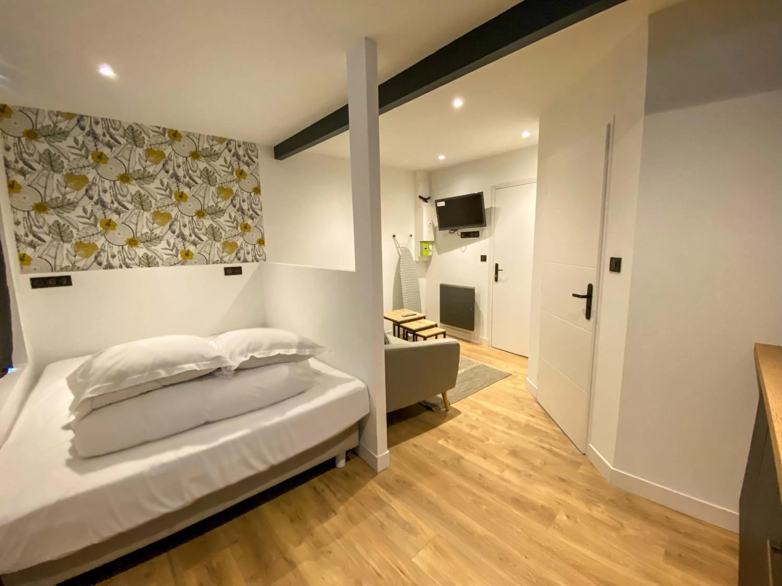 Bed in Le Bras d'or Apparts et Spa