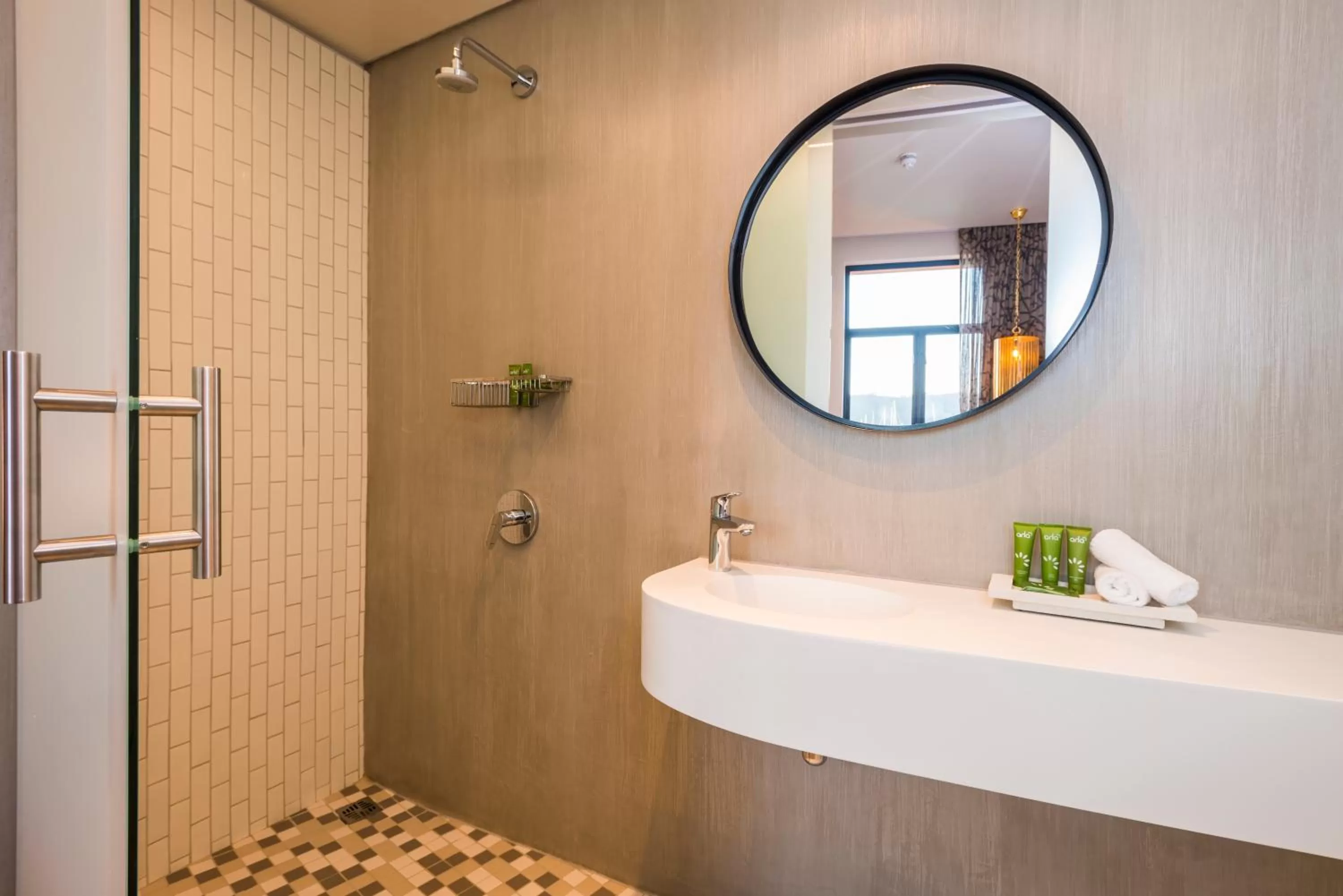 Bathroom in aha The Rex Hotel