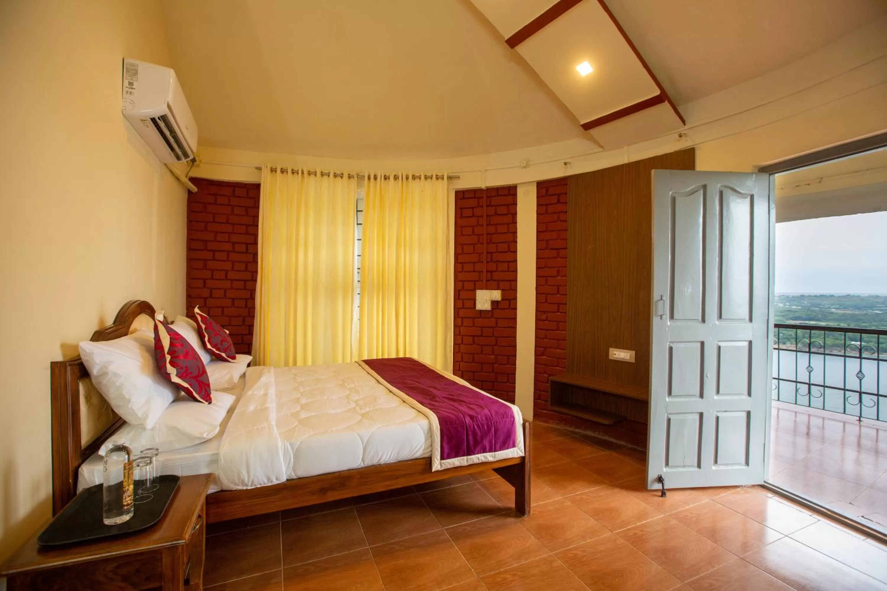 Bed in KSTDC Hotel Mayura Krishna Almatti