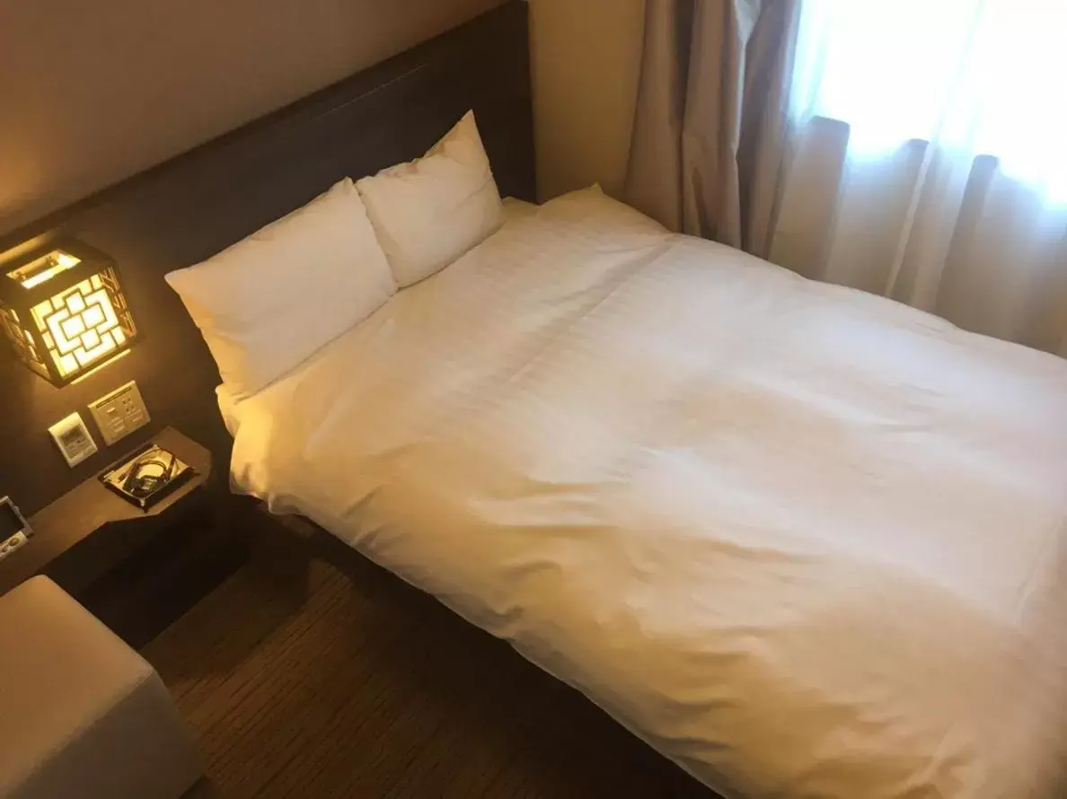 Photo of the whole room, Bed in Dormy Inn Nagasaki Shinchichukagai