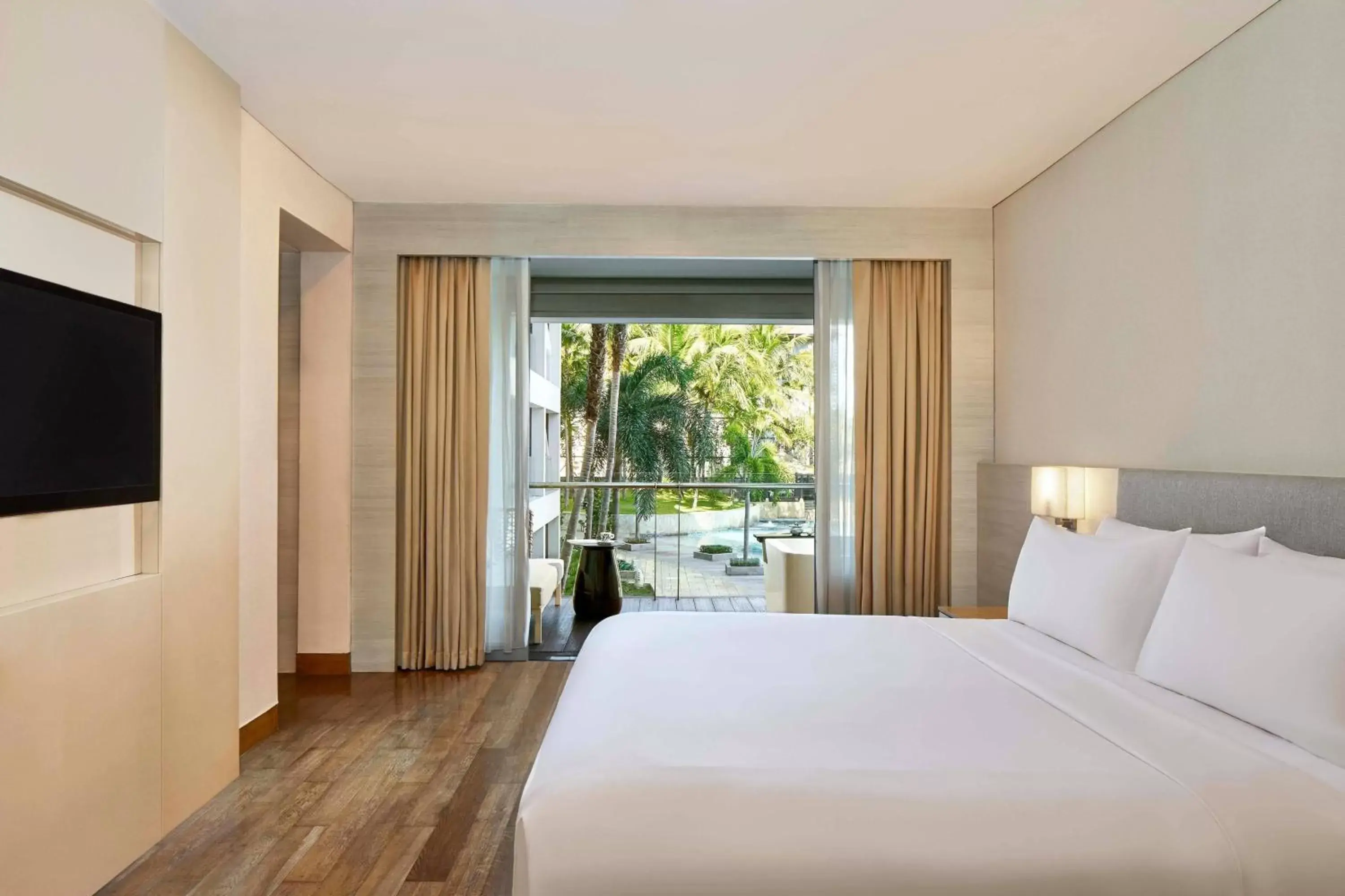 Swimming pool, Bed in The Stones - Legian, Bali - A Marriott Autograph Collection Hotel