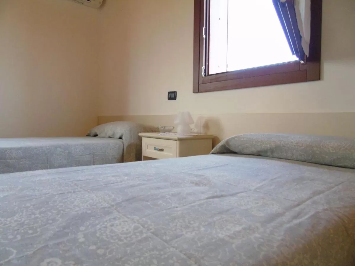 Bed in B&B Ai Cipressi