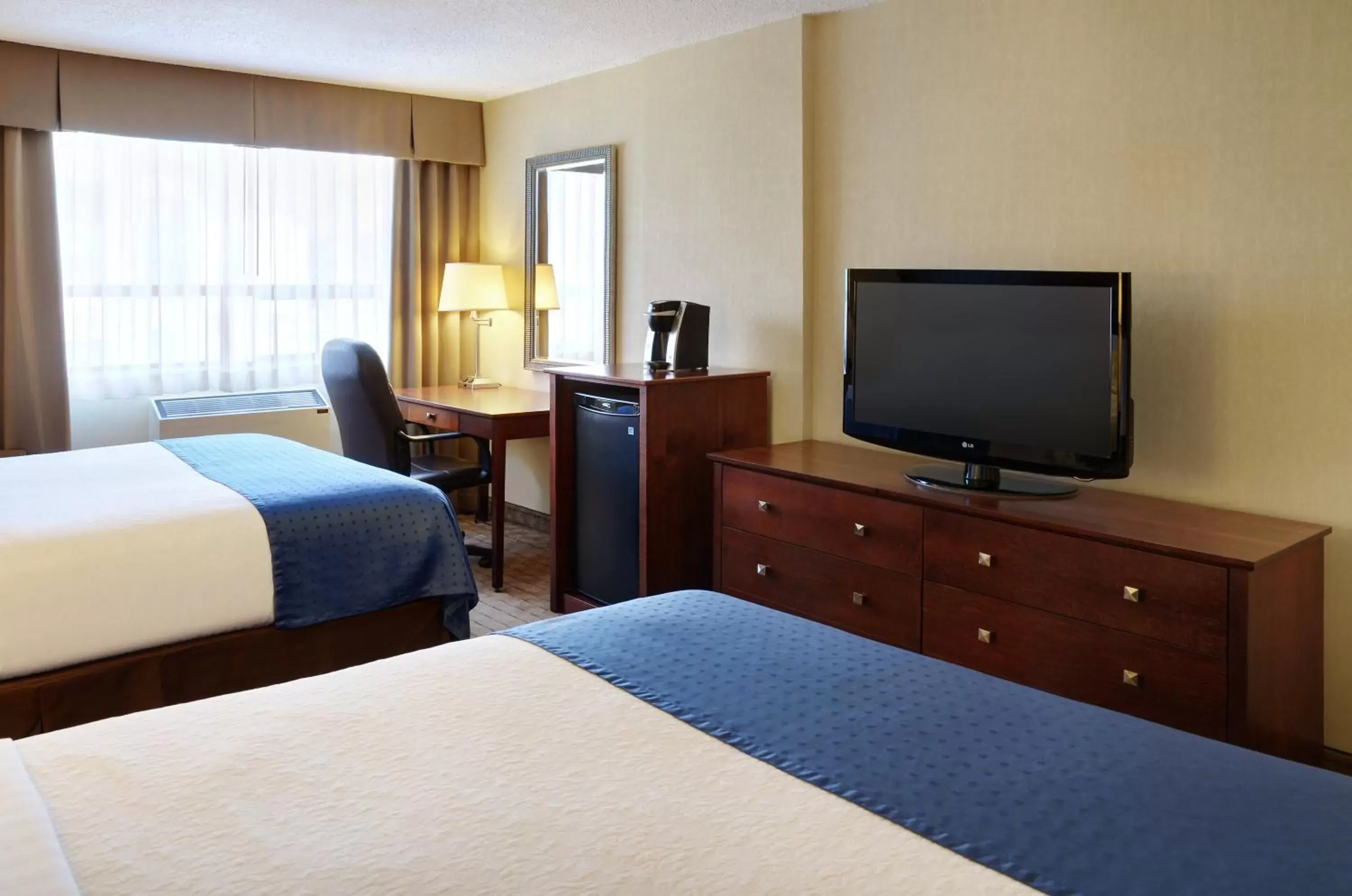 Photo of the whole room, Bed in Holiday Inn & Suites Winnipeg Downtown, an IHG Hotel