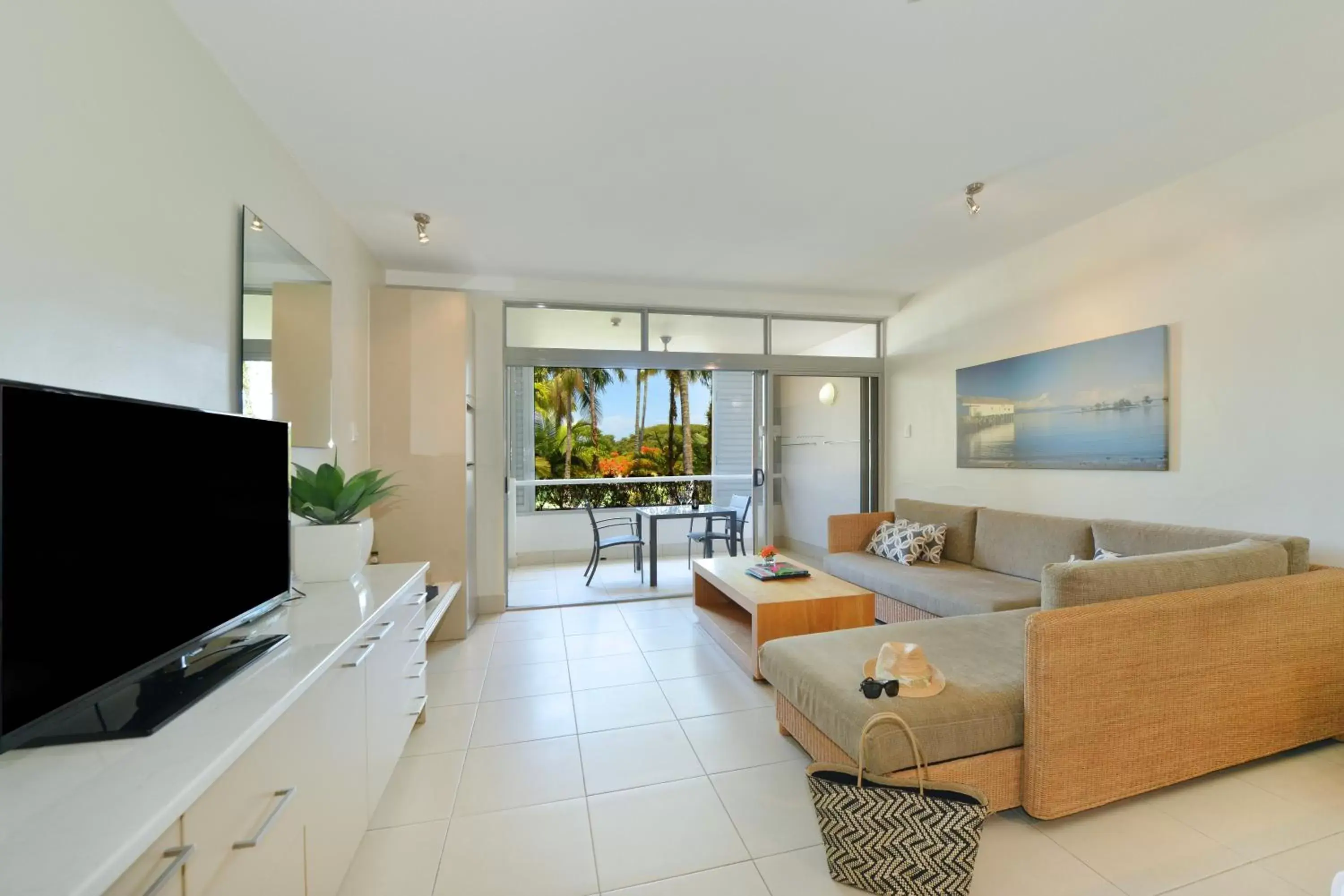 Photo of the whole room, TV/Entertainment Center in Club Tropical Resort with Onsite Reception & Check In