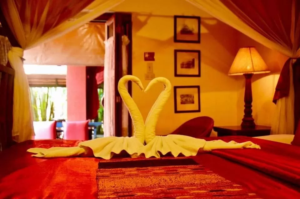 Bed in Tri Yaan Na Ros Colonial House