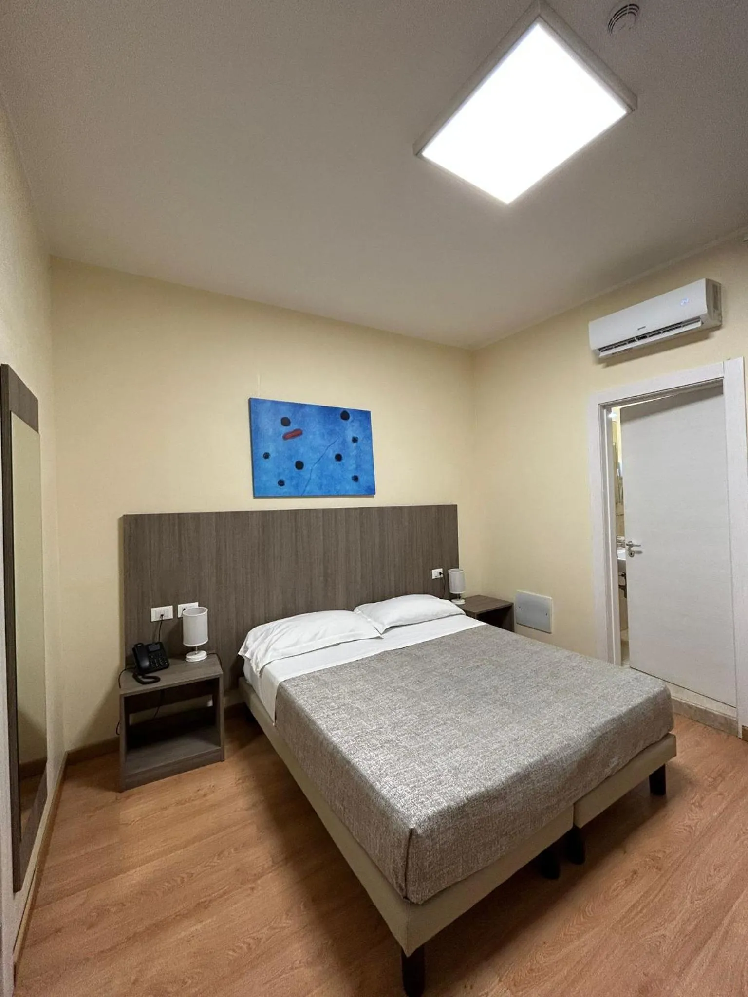 Bed in 55 Aira Hotel