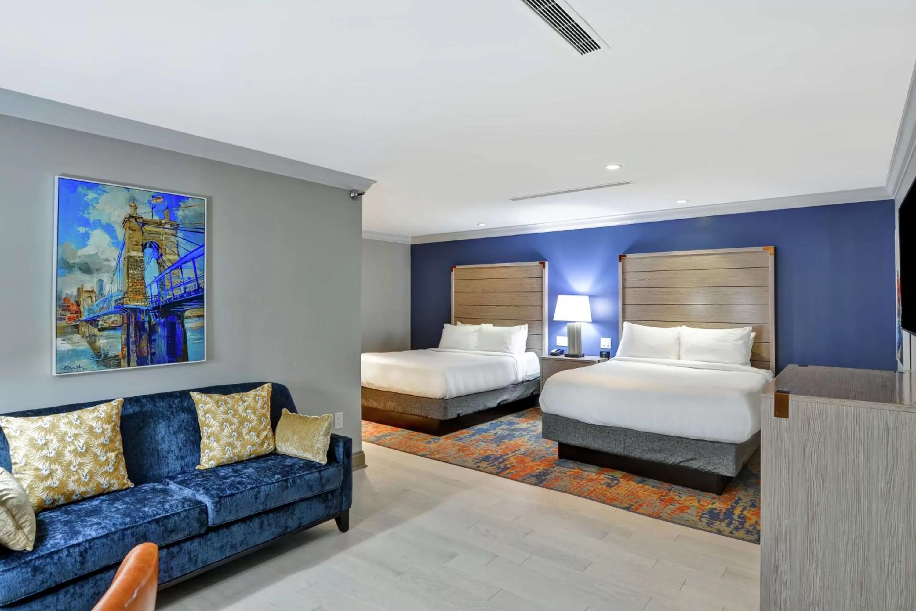 Living room, Bed in The Cincinnatian Curio Collection by Hilton