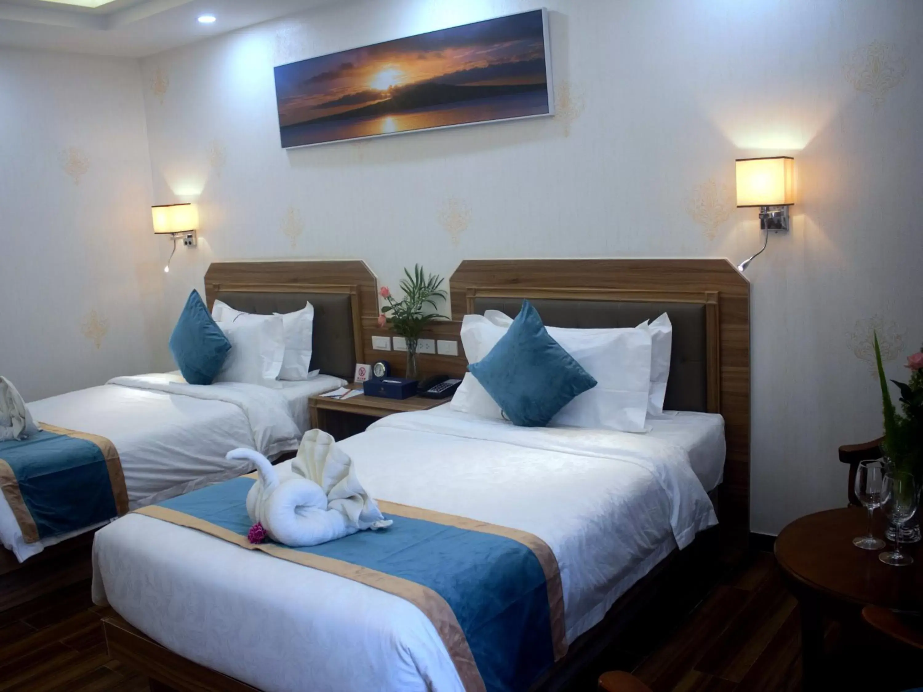 Bed in Costa Palawan Resort