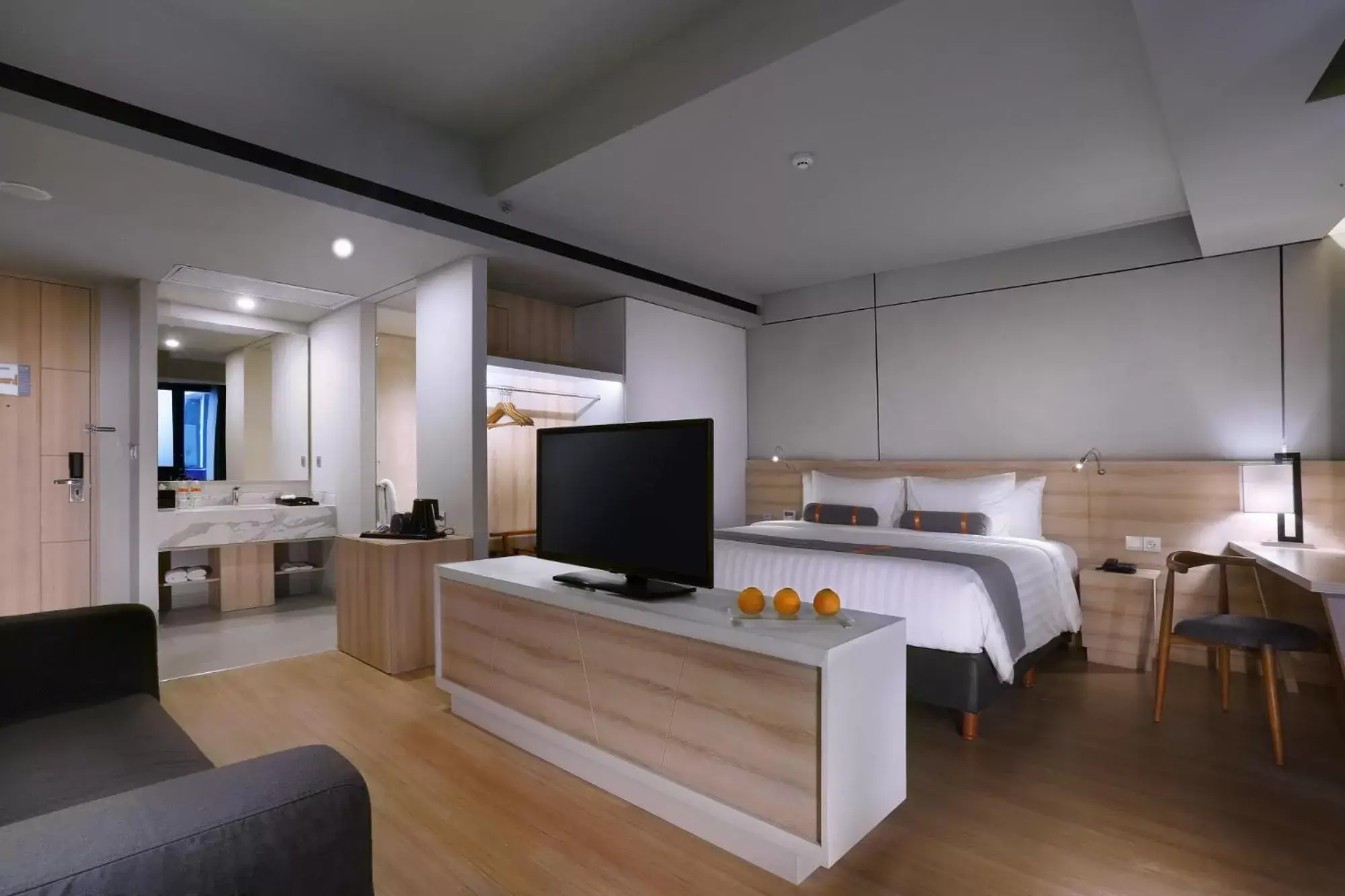 Bedroom, TV/Entertainment Center in Harper Cikarang by ASTON