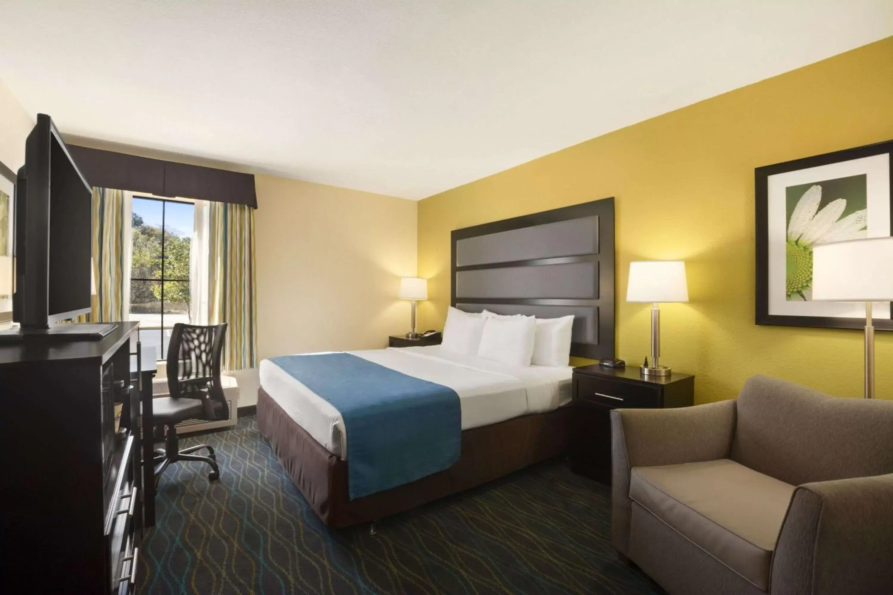 Photo of the whole room in Days Inn & Suites by Wyndham Commerce