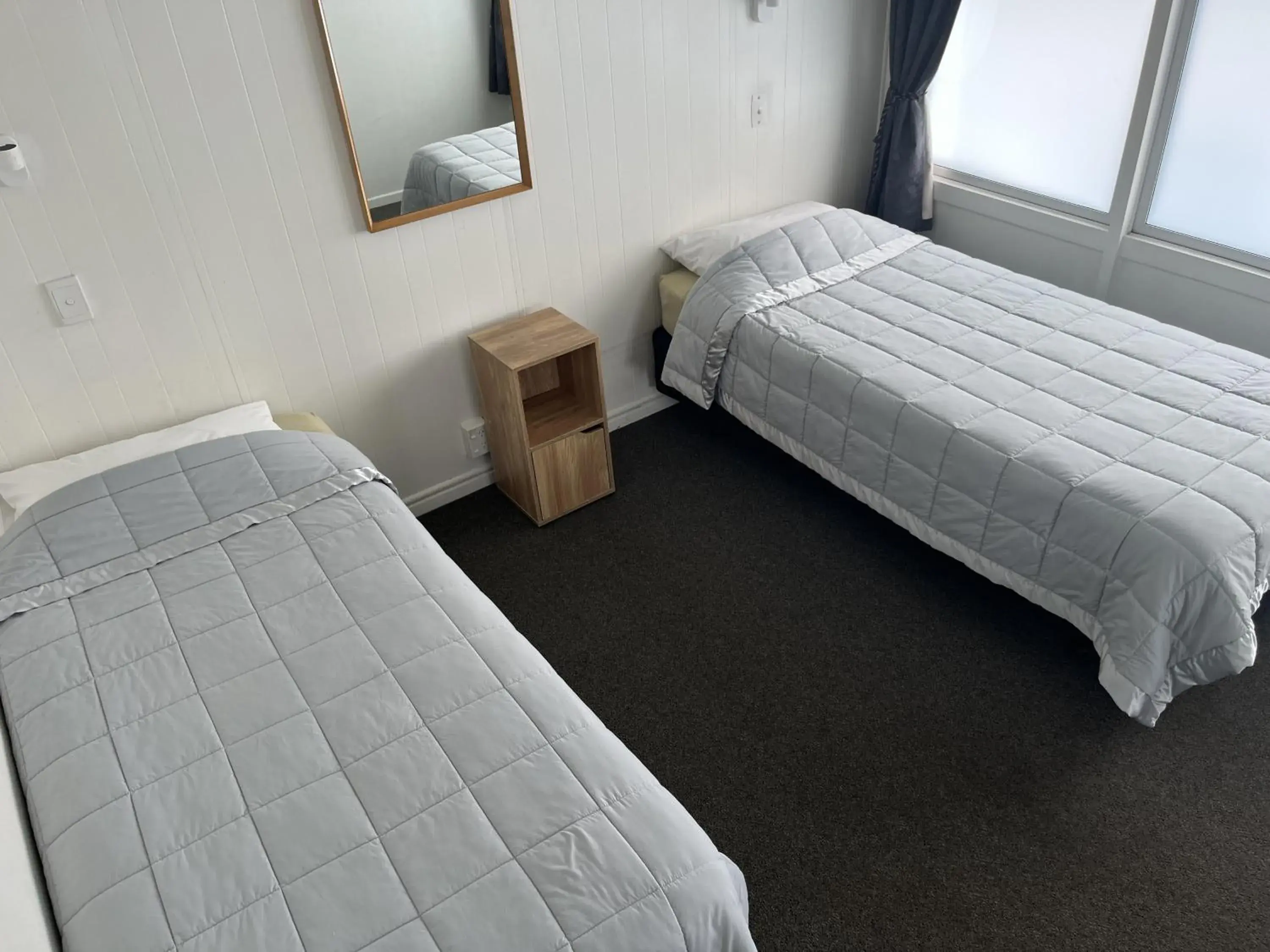 Bed in Central Court Motel