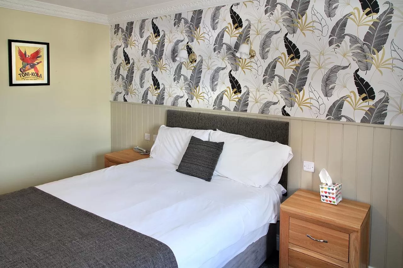 Bed in The Marine Hotel