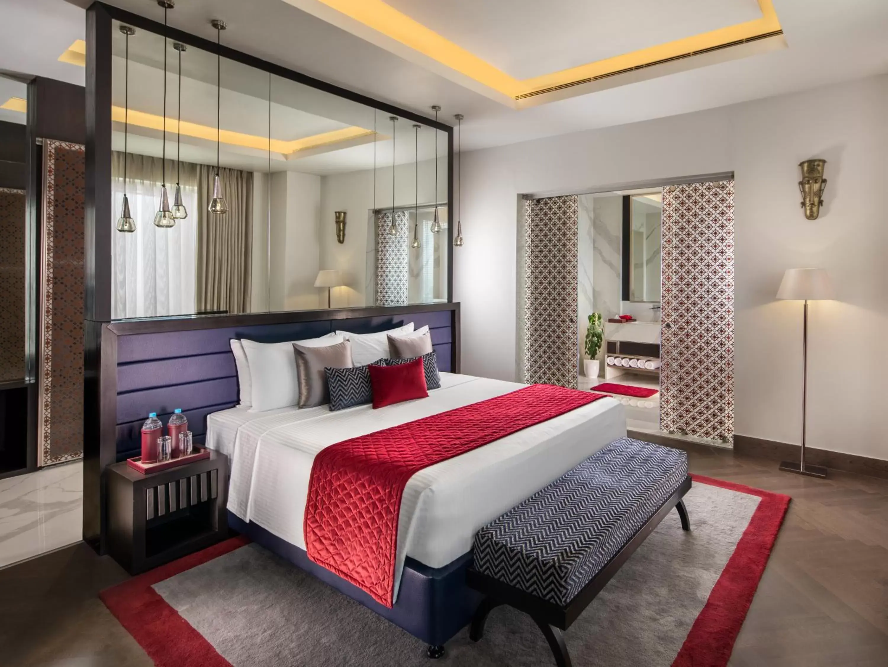 Bed in Sandal Suites by Lemon Tree Hotels