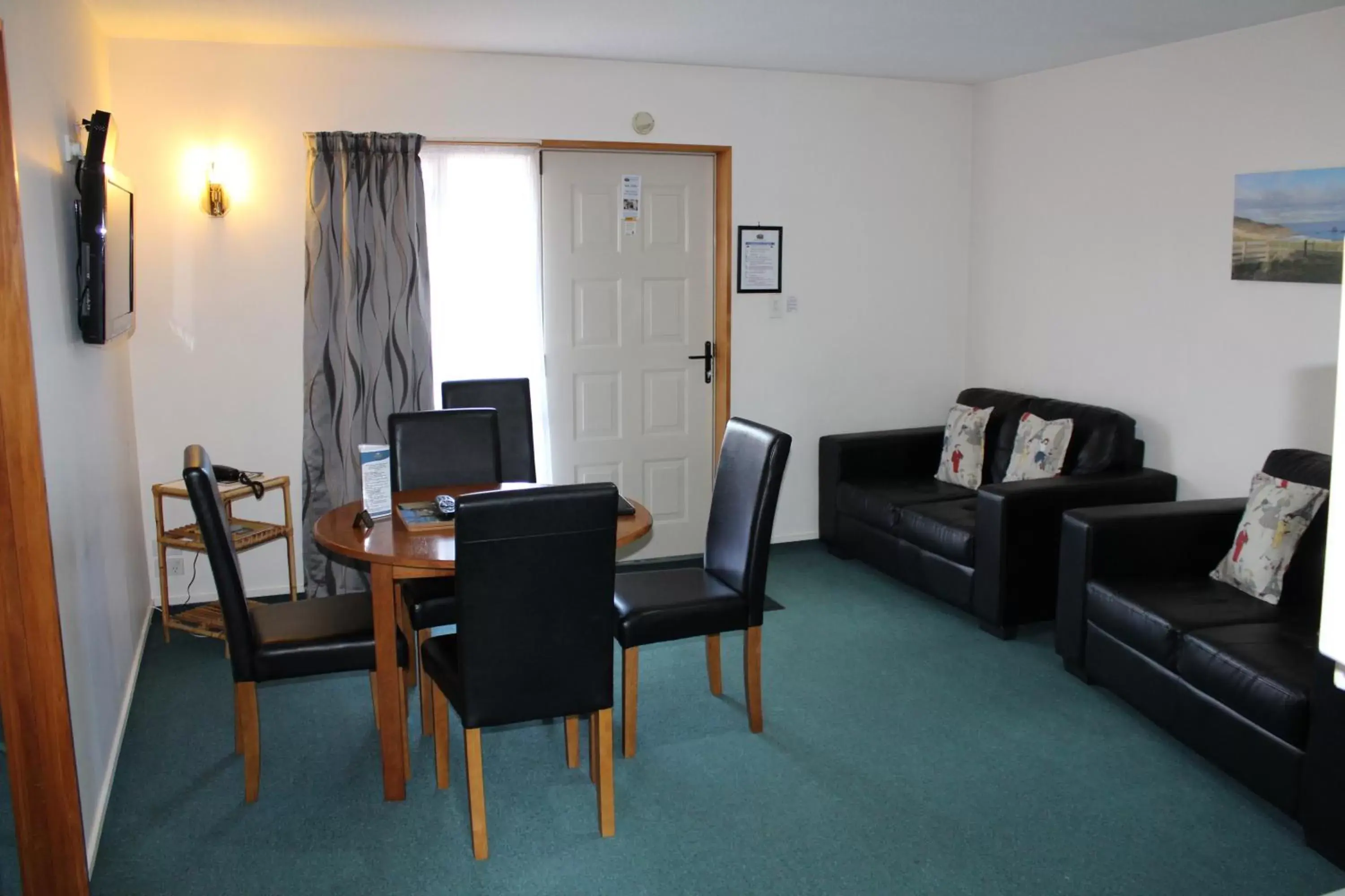 Seating Area in ASURE Ambassador Motor Lodge