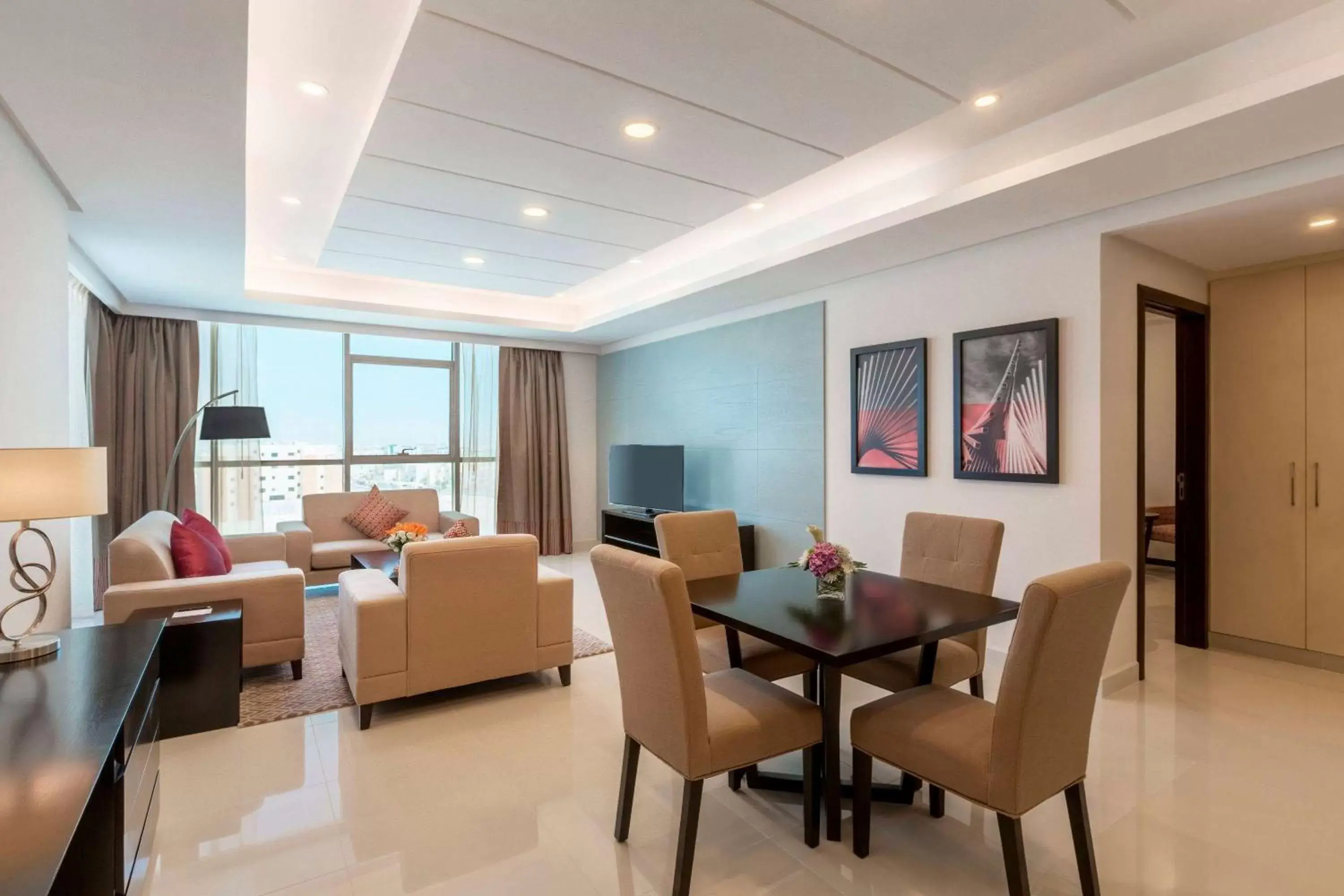 Bed, Dining Area in Ramada Hotel and Suites Amwaj Islands