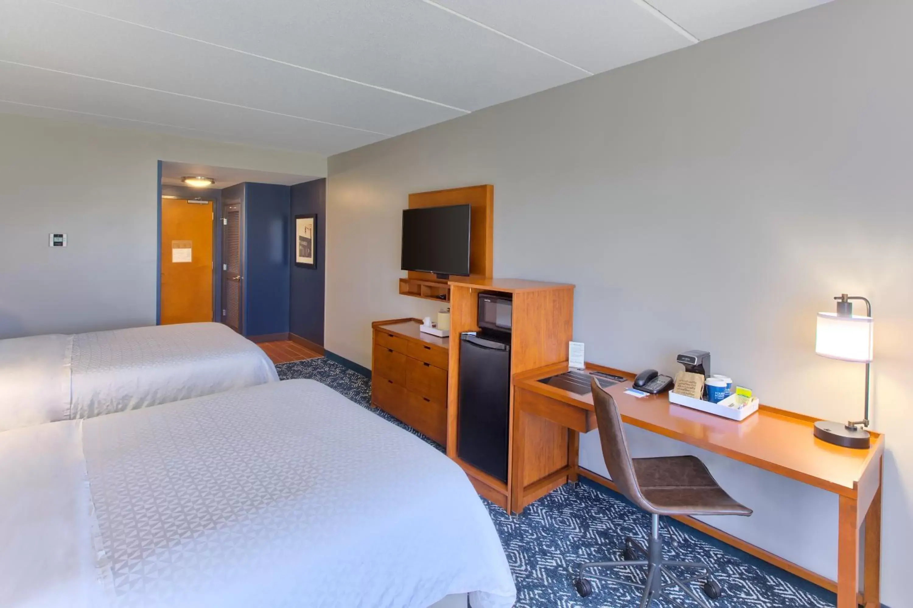 Bed, TV/Entertainment Center in Four Points by Sheraton Raleigh Durham Airport