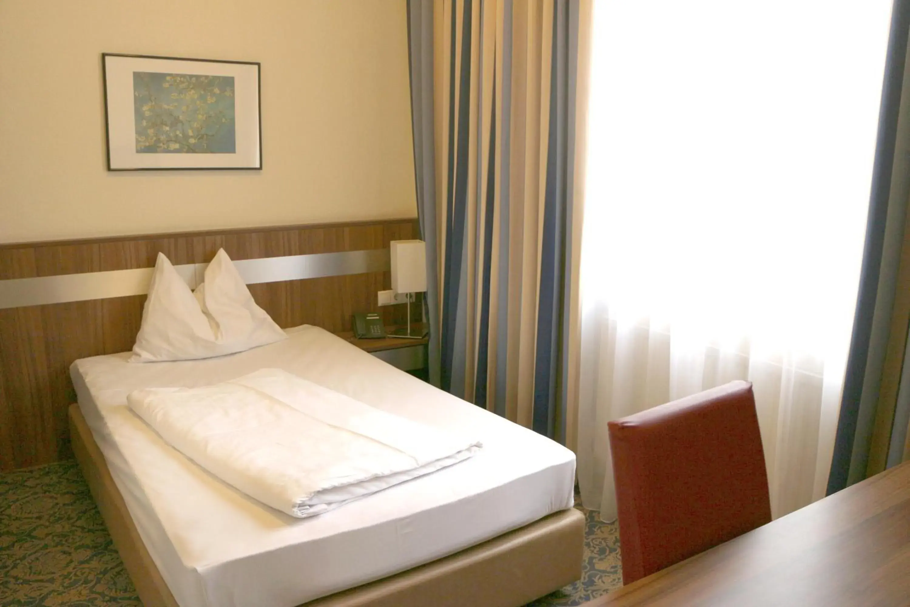 Bed in Hotel Carina