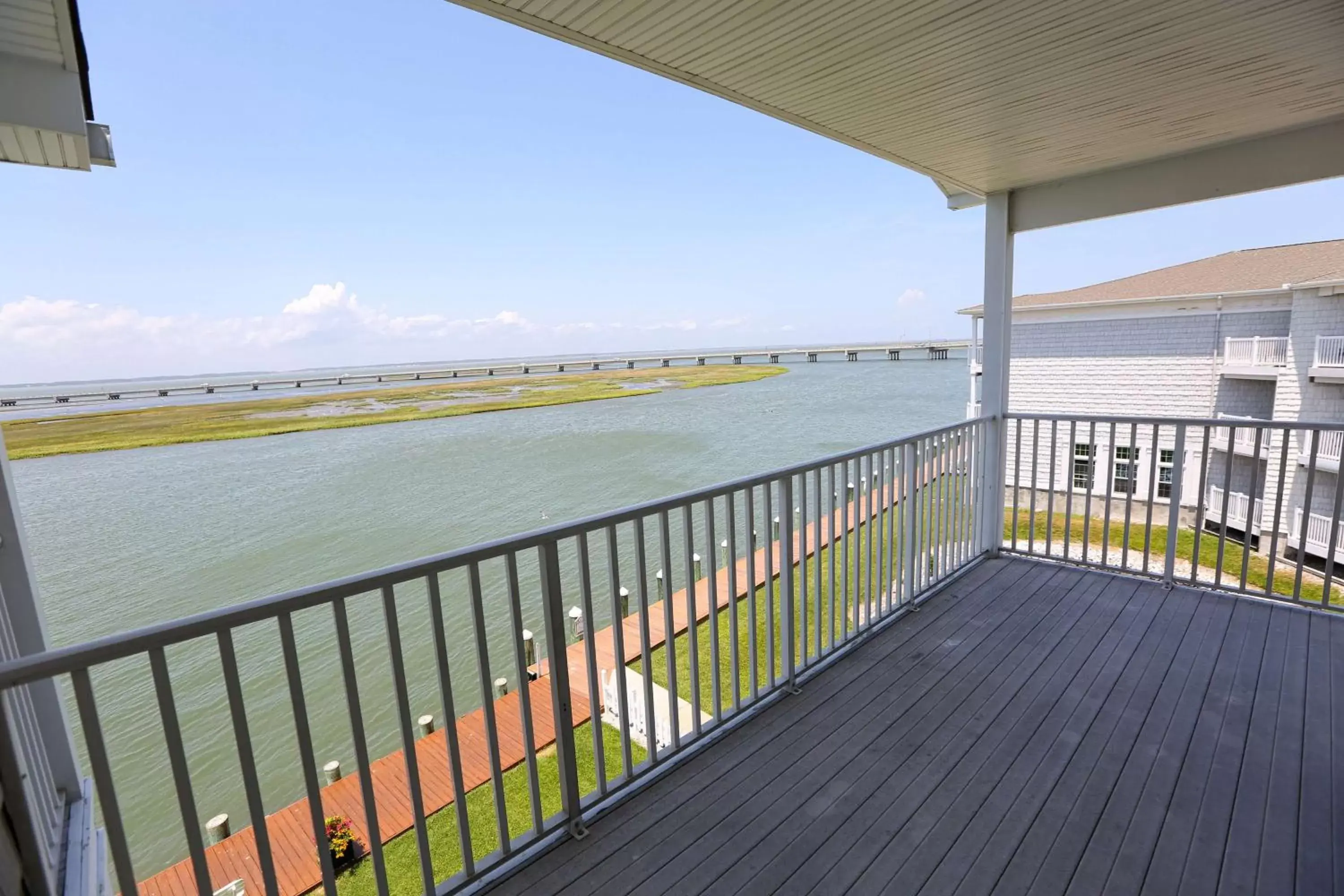 Bed, Balcony/Terrace in Hampton Inn & Suites Chincoteague-Waterfront, Va