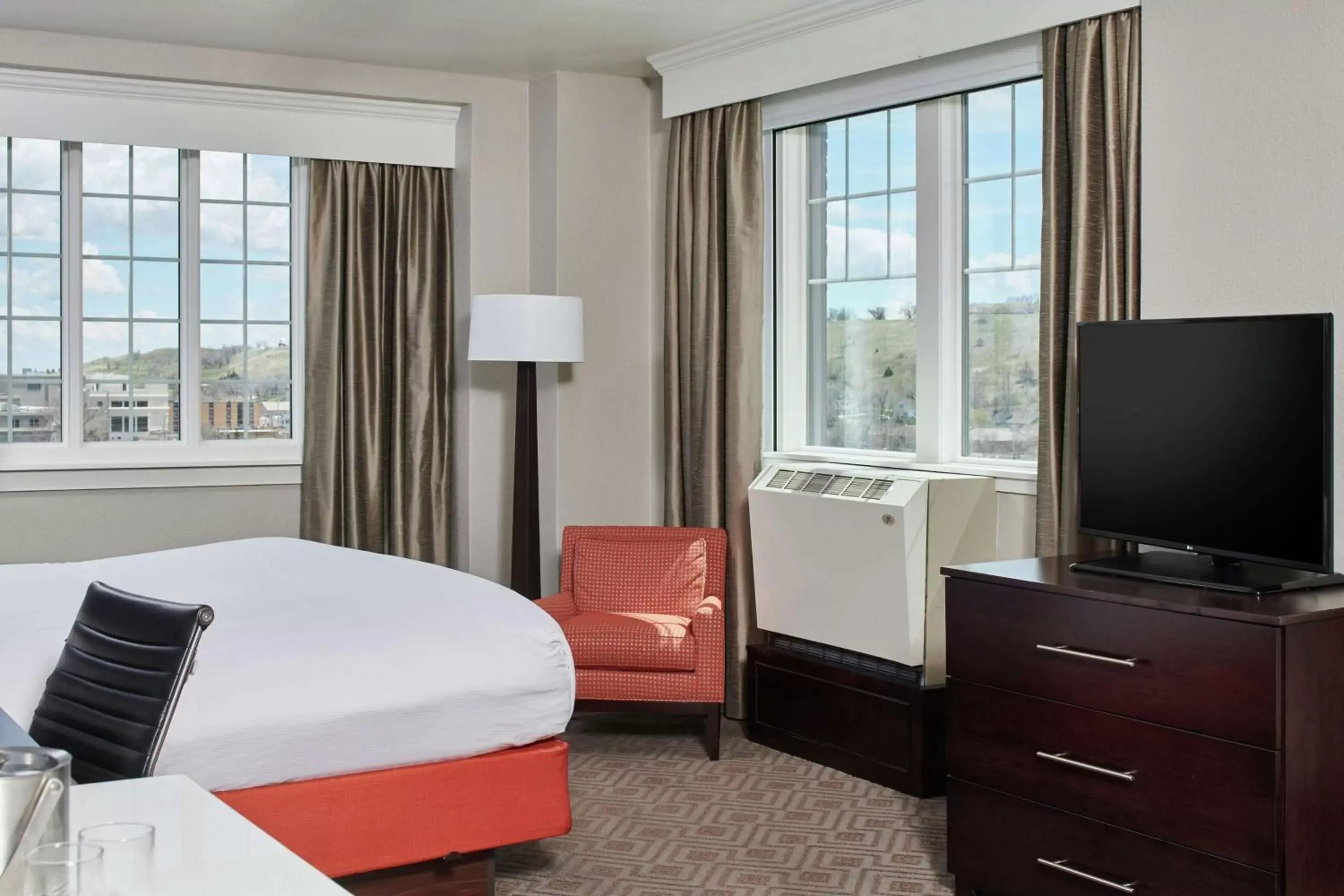 Bed, TV/Entertainment Center in Hotel Alex Johnson Rapid City, Curio Collection by Hilton